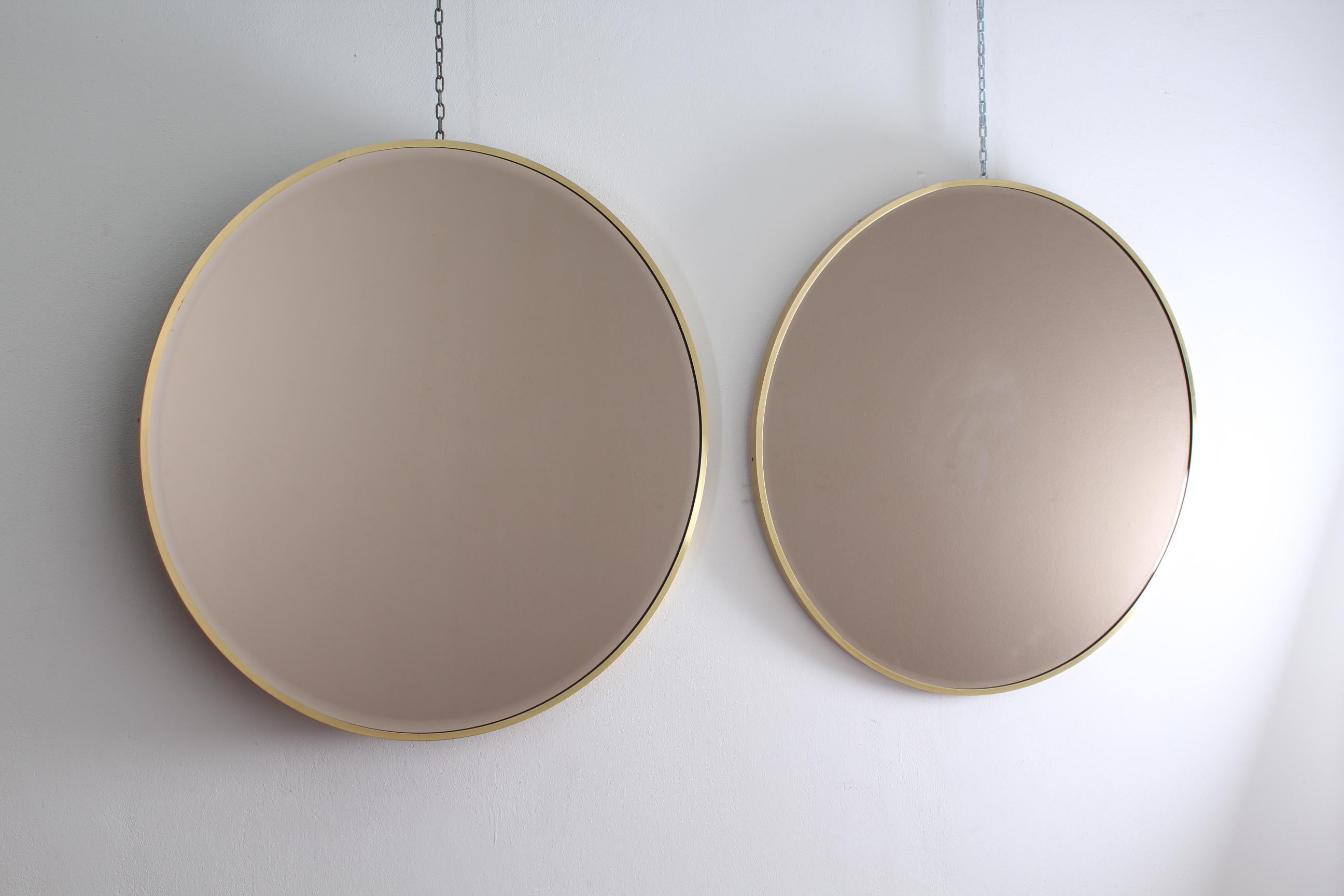 Stylish round brass and glass pair of mirrors, attribuited to Gio'  Ponti ,Italy 1960s.
Wear consistent with age and use.