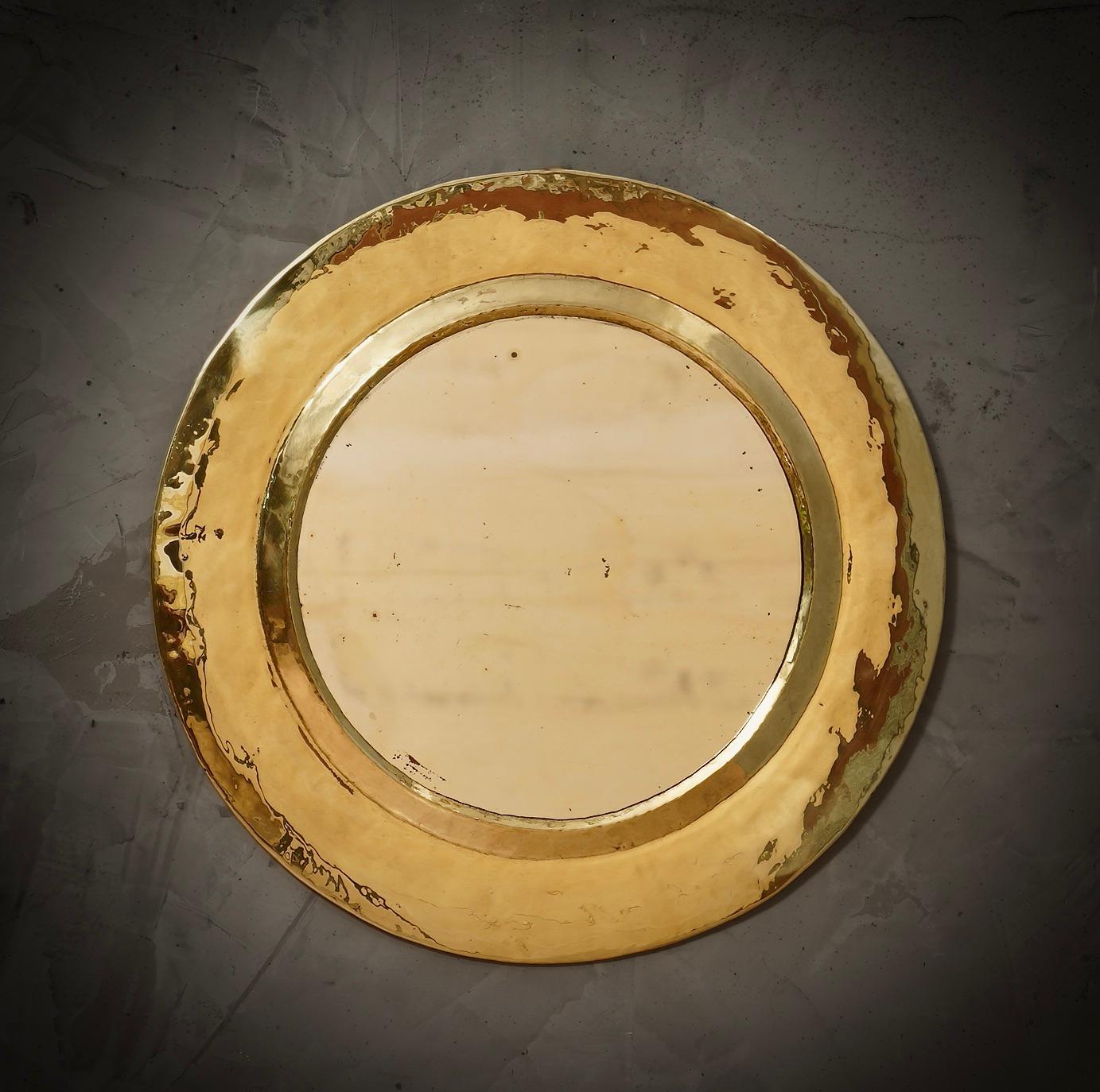 Simple finishes, a real sun shine, this mirror is truly one of a kind. Simple but very very beautiful design.

The mirror is round and small in size. It is composed of a large hand-crafted brass molding. Inside the frame is the small glass mirror.