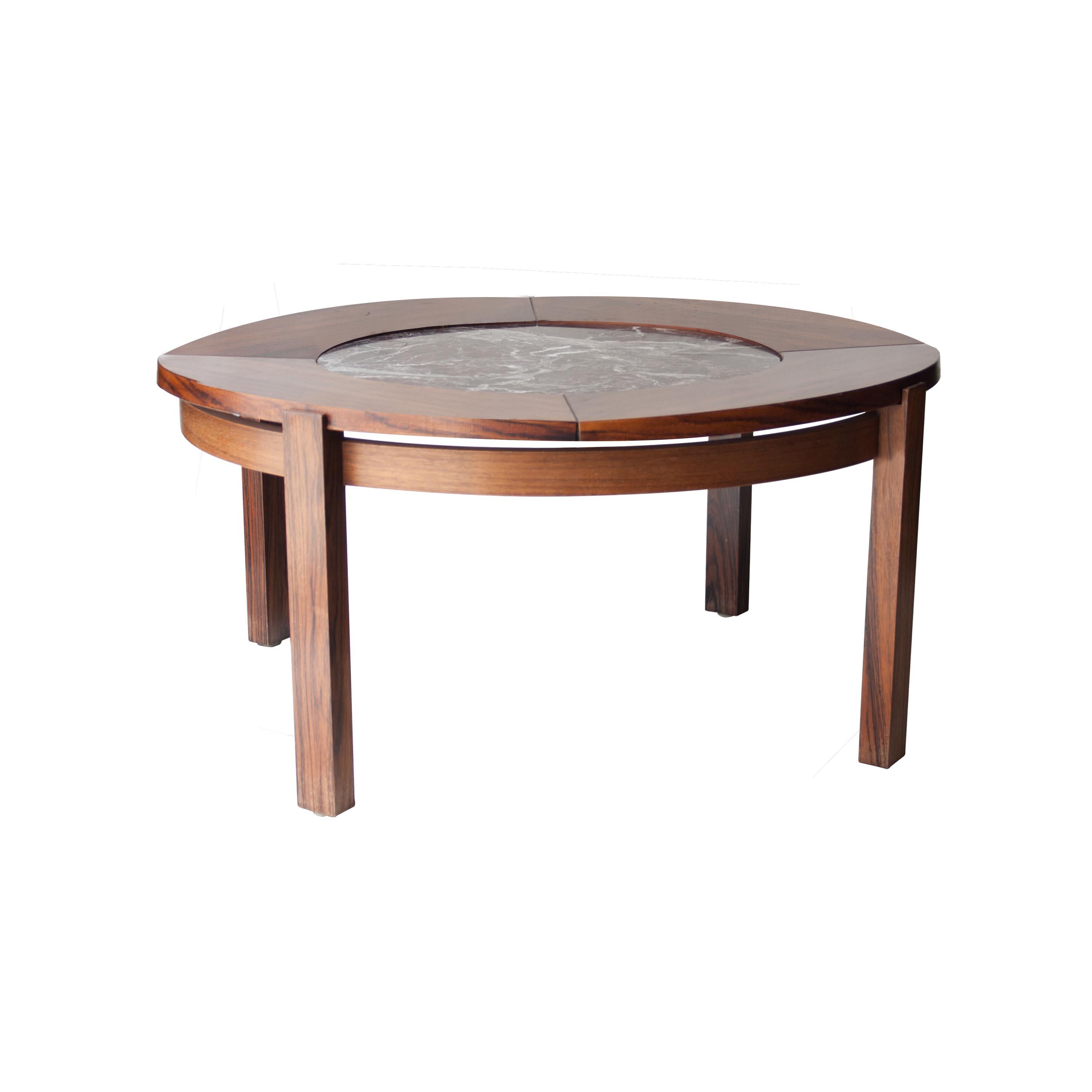 Coffee table in rounded shape. Structure made of mahogany wood with marble centerpiece top.