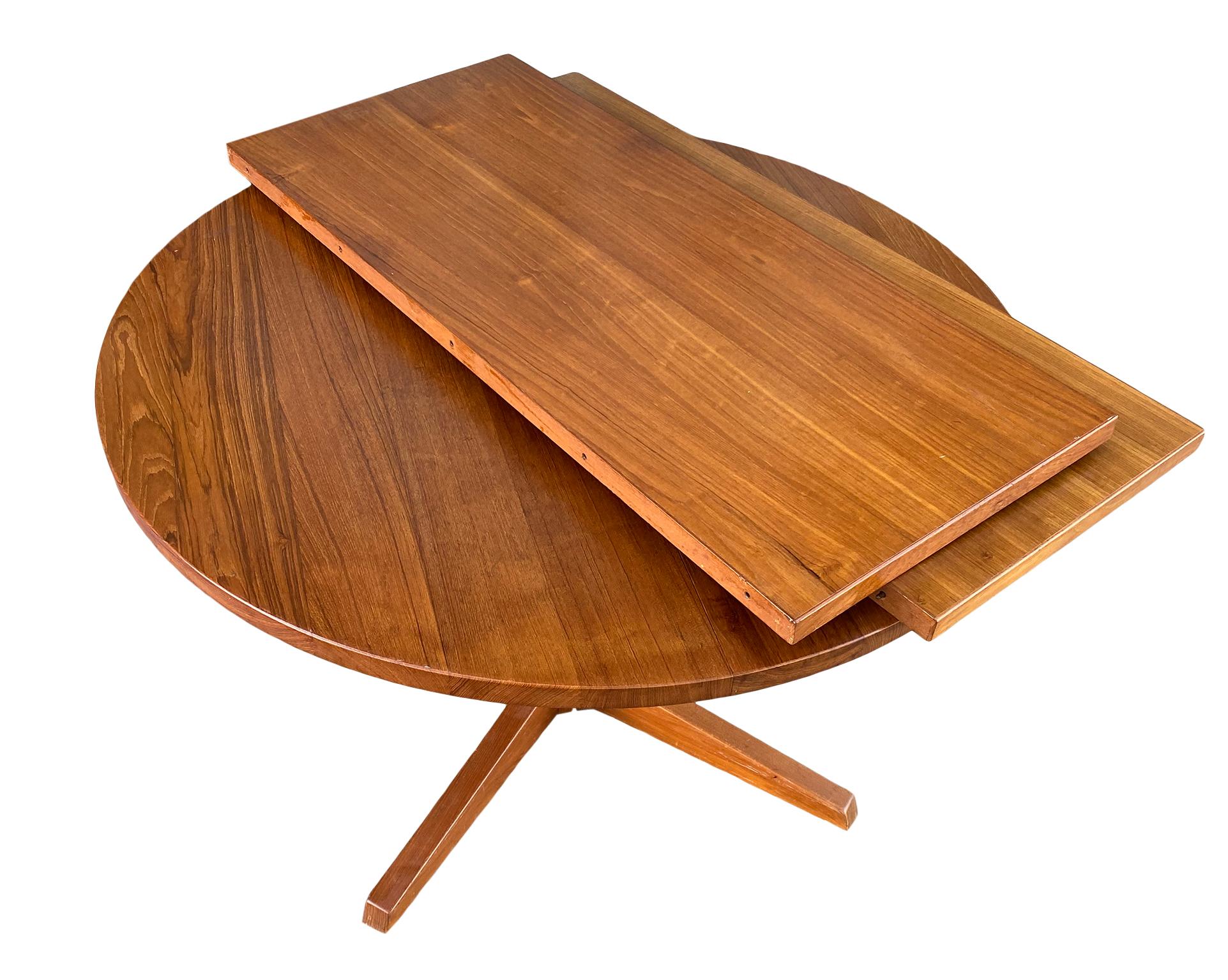 Midcentury solid teak Danish extension dining table with (2) leaves. This table is very high quality hand built by CJ Rosengaarden Hojre. Solid teak legs with hexagon base. This table is in great vintage condition, all (2) leaves match the table