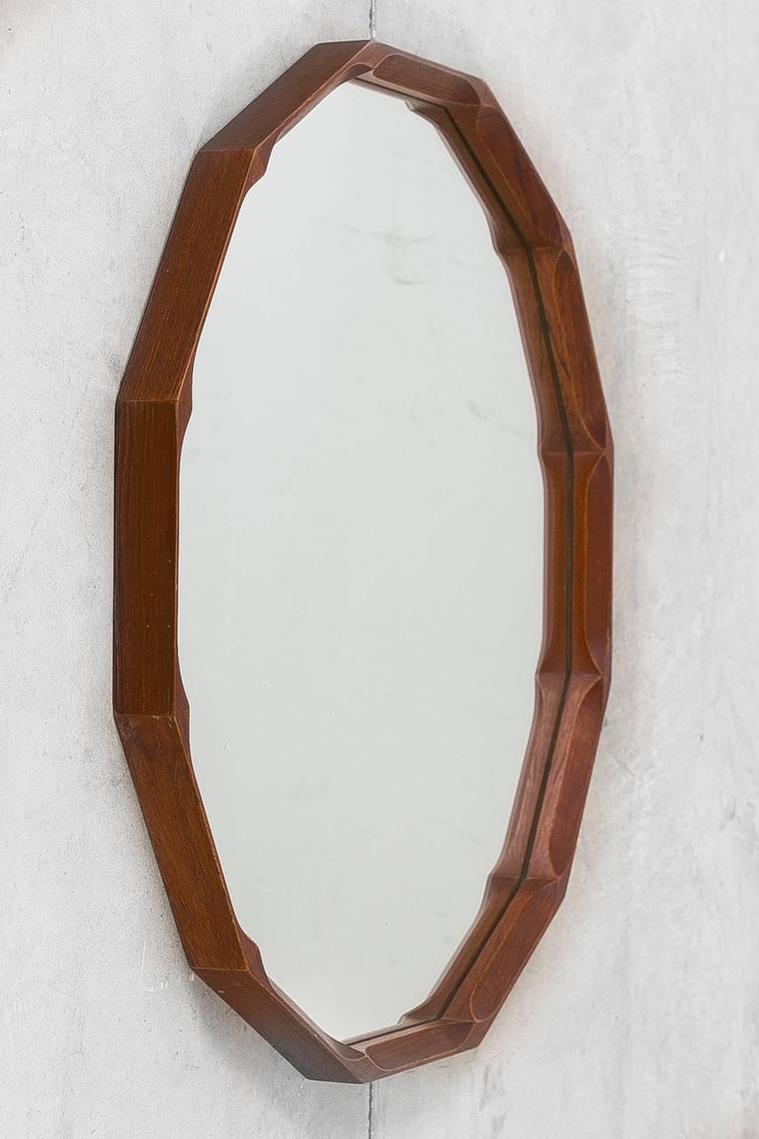 Midcentury round mirror featuring etched teak surround, 1950s.