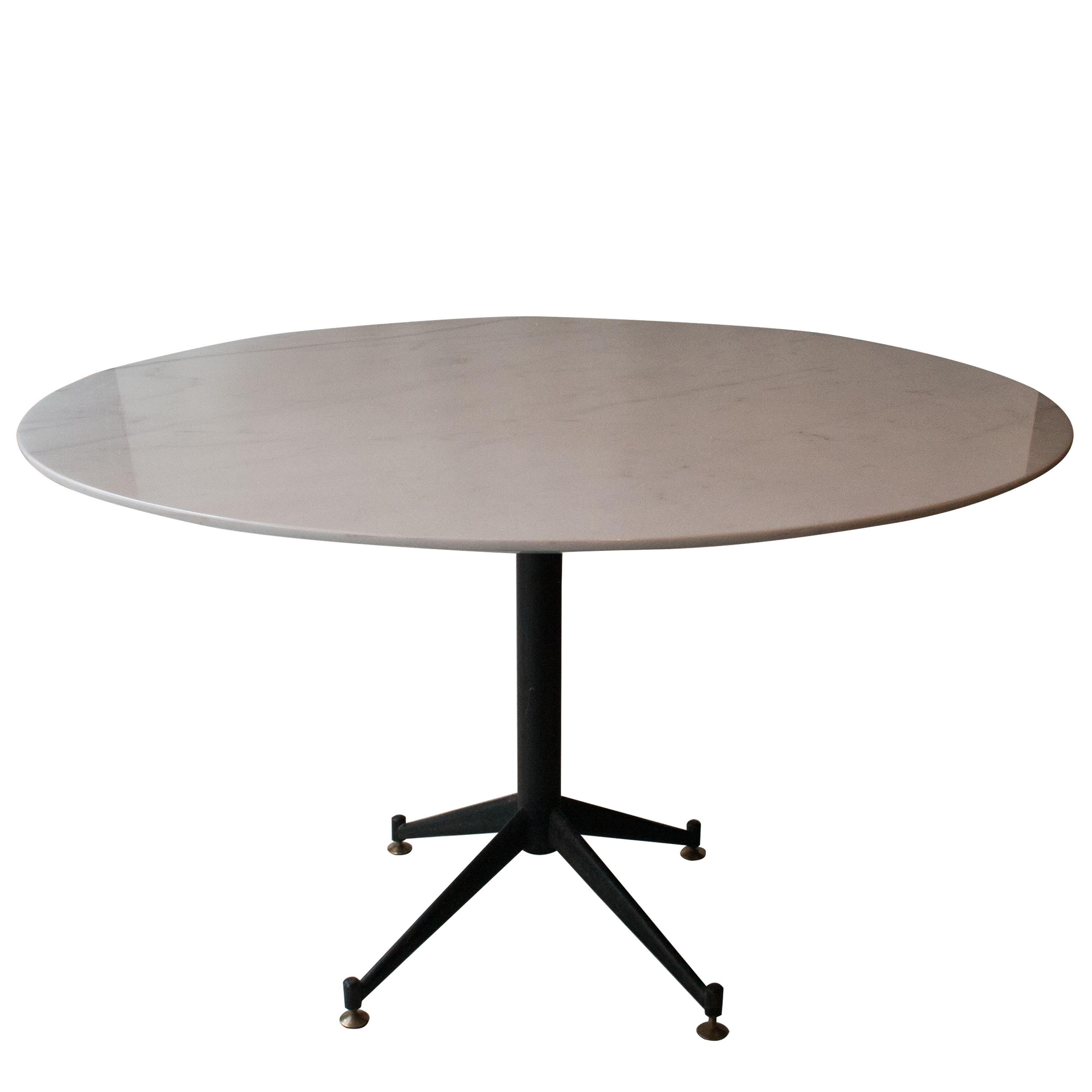Round dining table with white Ibiza marble-top and metal foot with black lacquered four feet support with height adjustable pads.