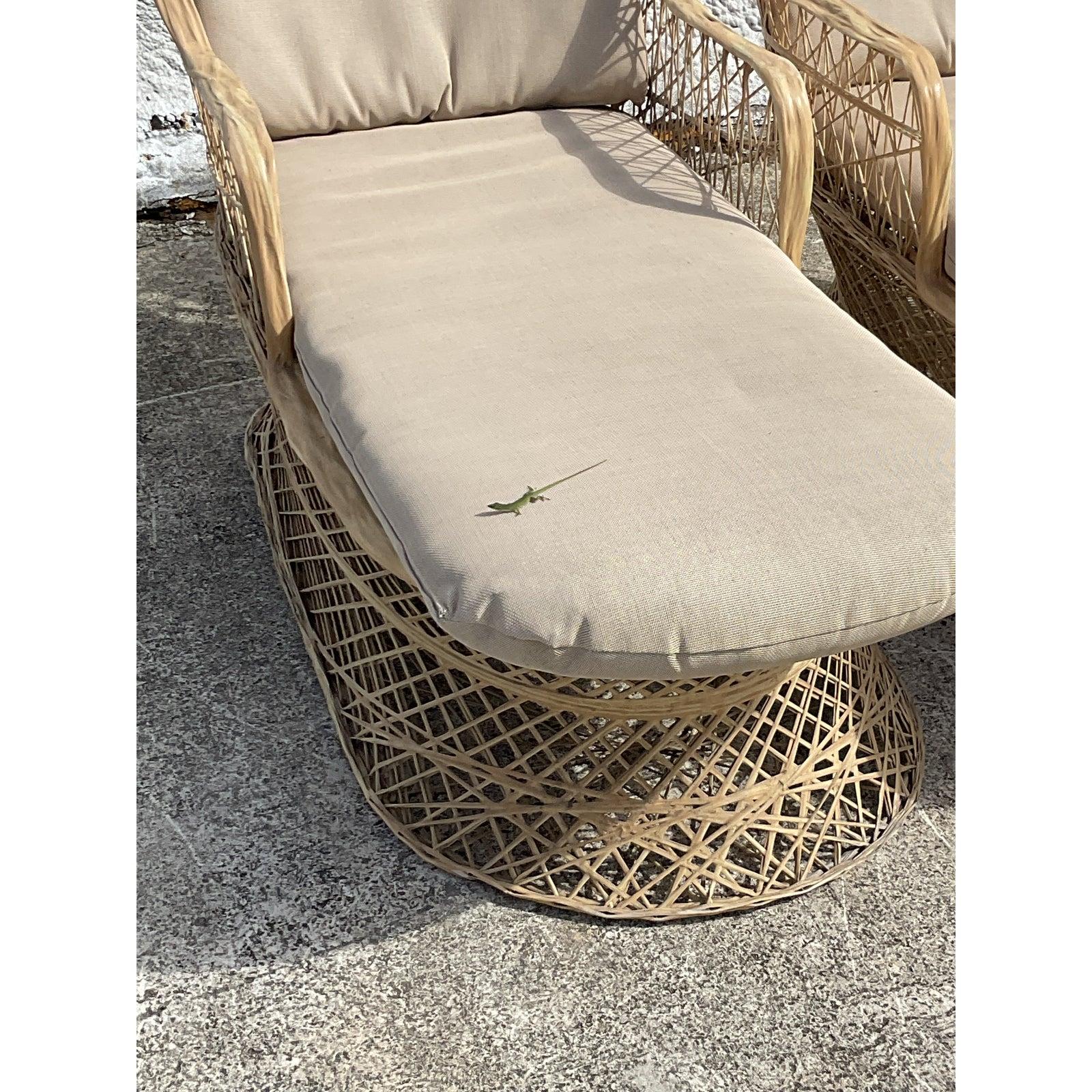 Fantastic pair of vintage spun fiberglass chaise lounge chairs. Made by the iconic Russell Woodard. Done in a pale fawn color with an color coordinated cushion. Unmarked. Acquired from a Palm Beach estate.
