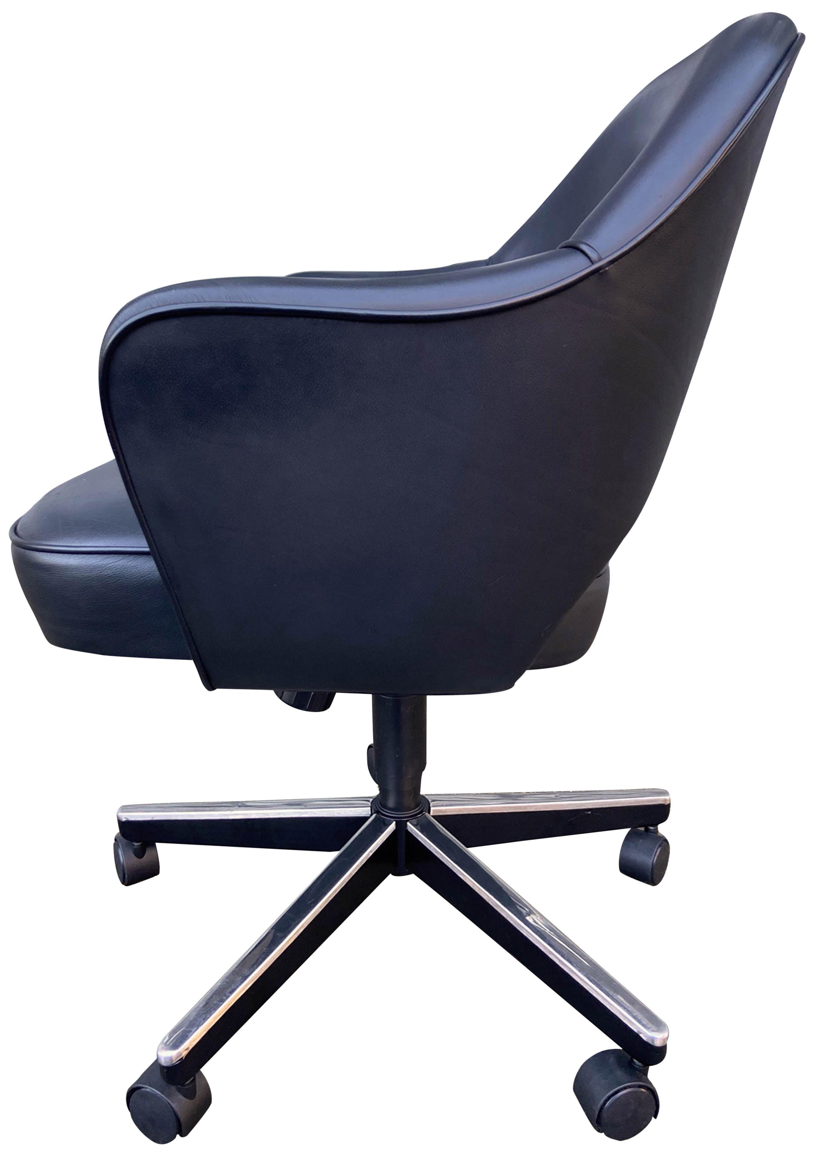 Midcentury Saarinen executive chairs in black leather. All with adjustable manual height and tilt positions. This iconic design has been a favorite in both the home and corporate settings due to its sharp looks and comfort. Seat height adjustable to