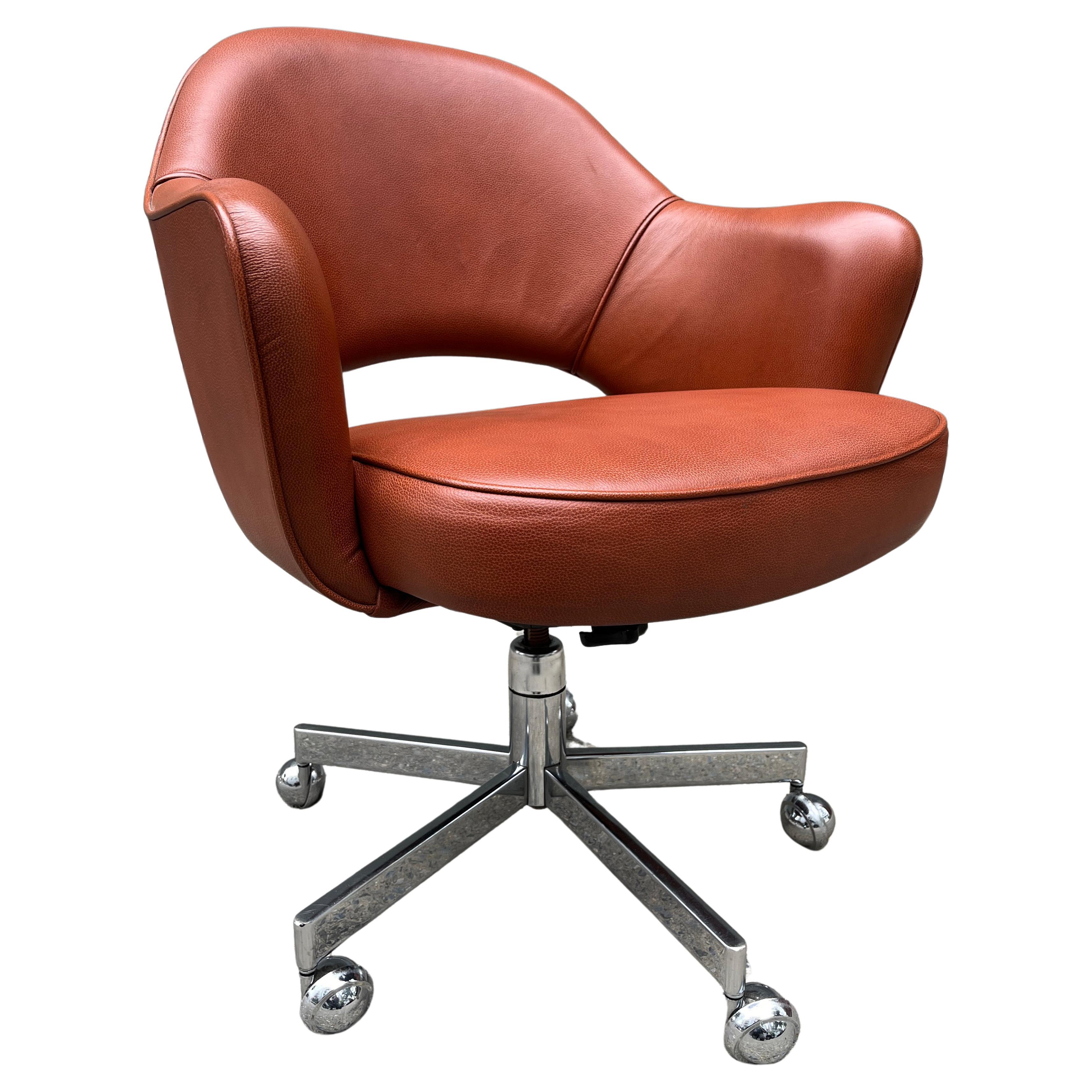 Midcentury Saarinen Executive chair in reddish brown / burns sienna leather. With manual adjustable height and tilt positions on a highly desirable chromed 5 star base. This iconic design has been a favorite in both the home and corporate settings