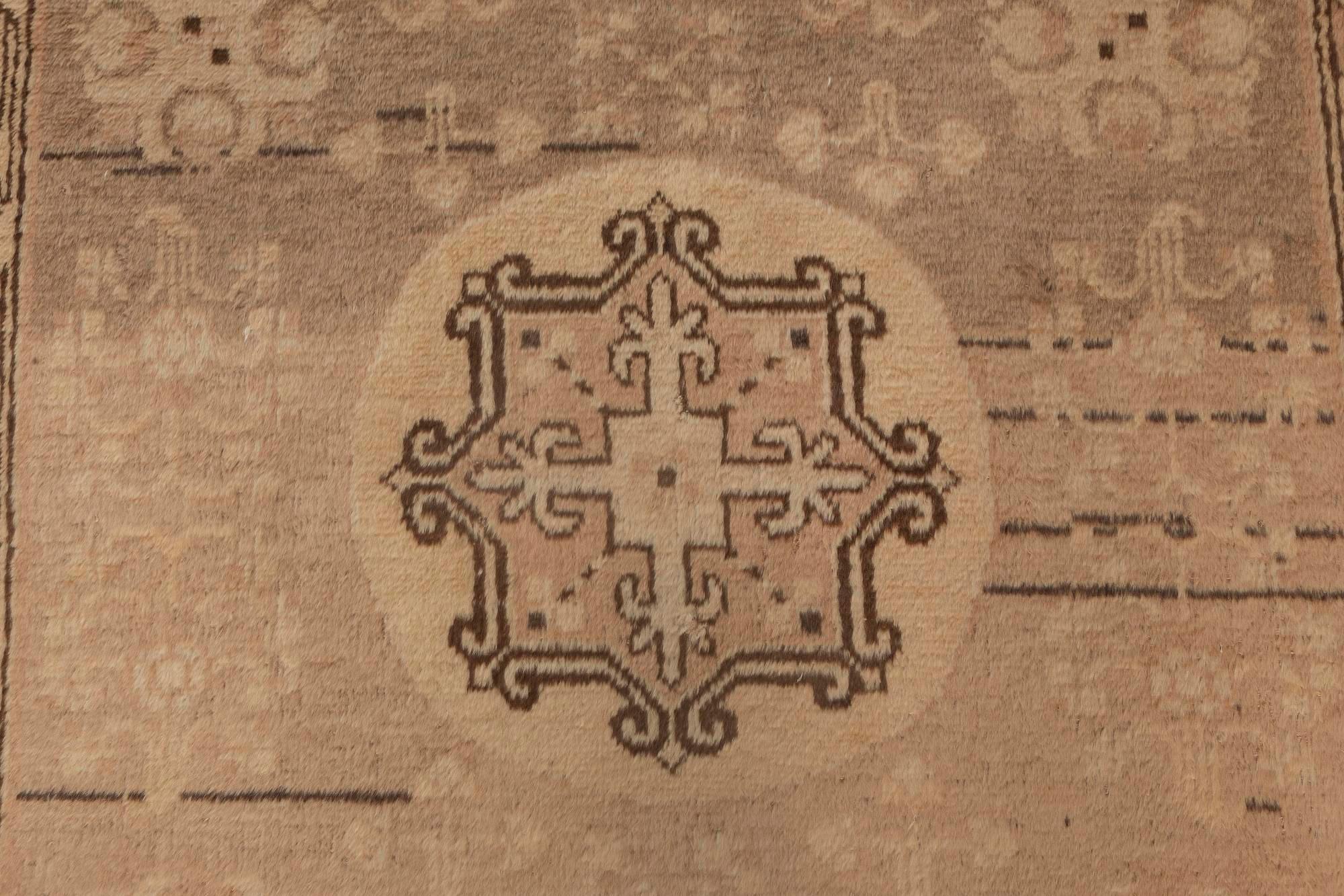 Midcentury Samarkand brown handwoven wool rug.
Size: 4'1