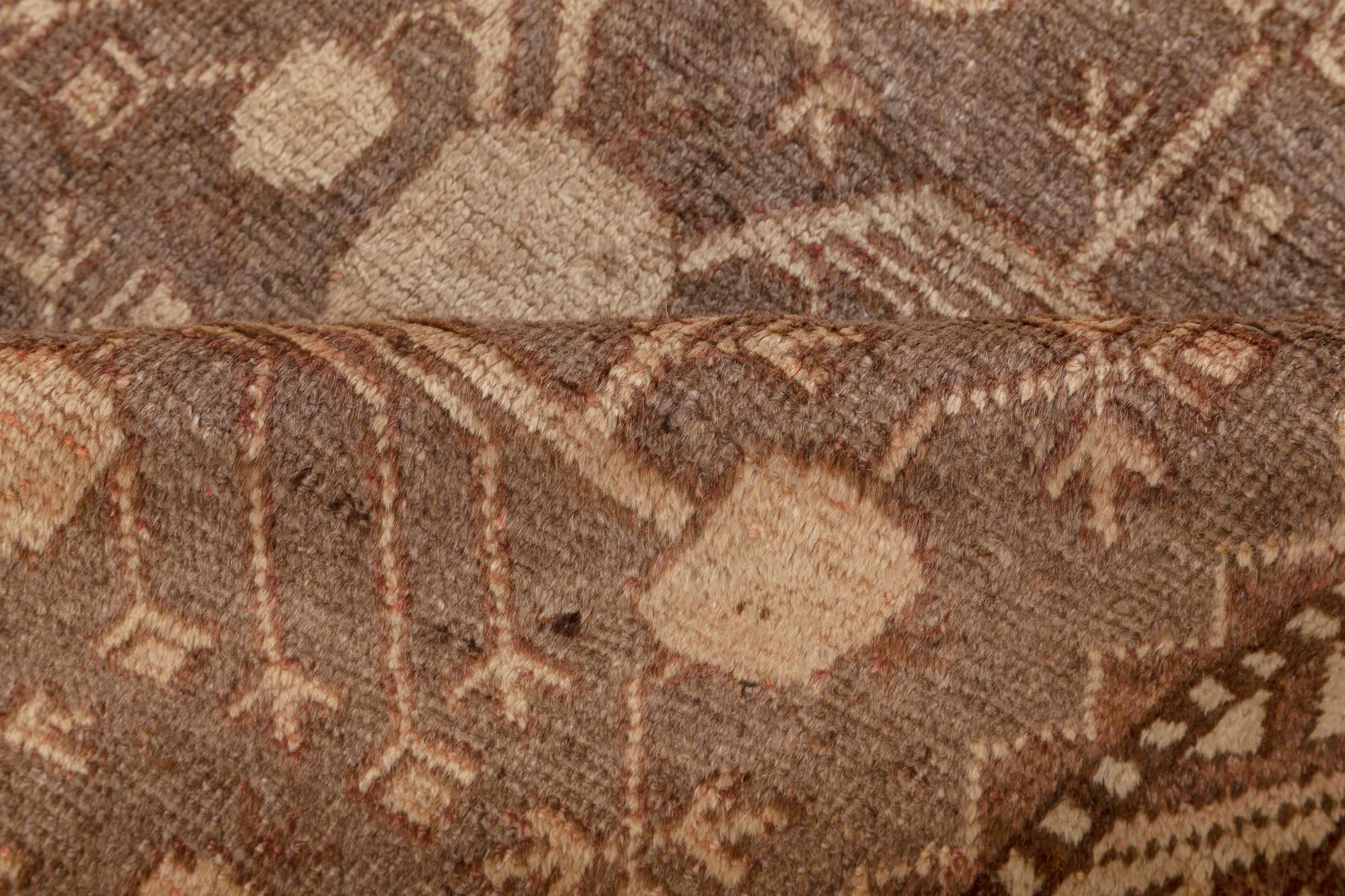 Midcentury Samarkand handmade wool rug in beige, brown and purple.
Size: 6'0