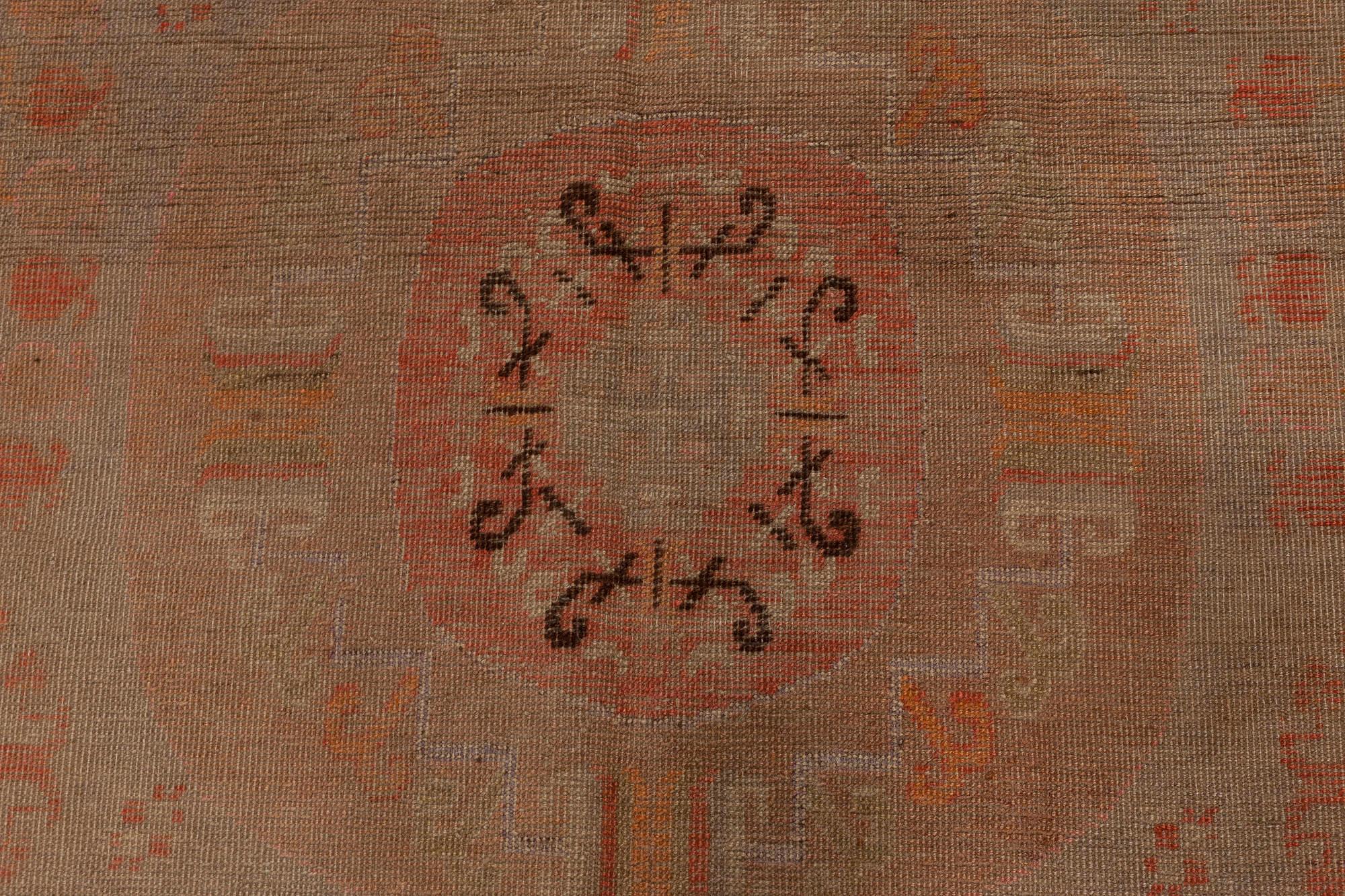 Midcentury Samarkand handmade wool rug
Size: 6'2