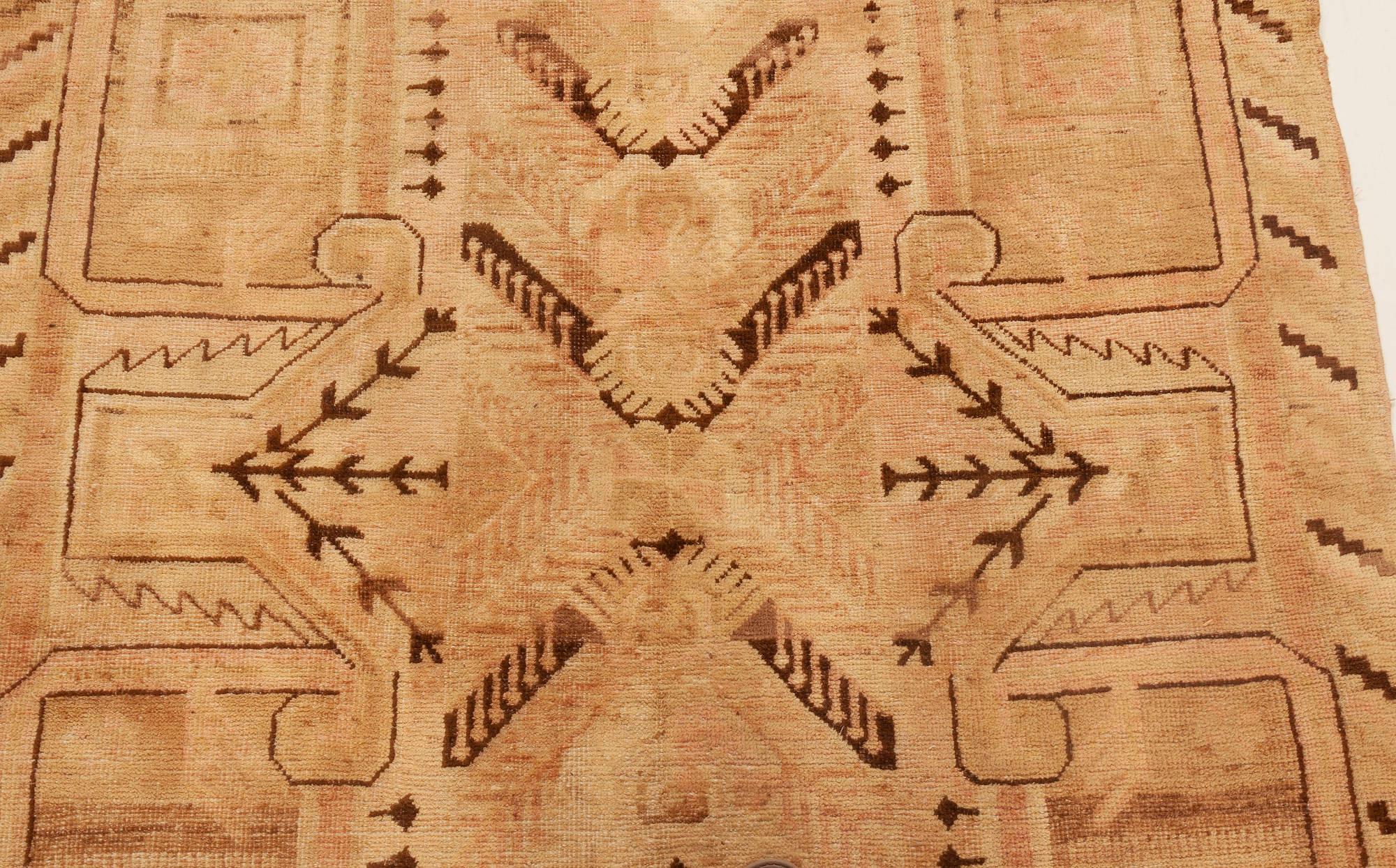 Midcentury Samarkand handwoven wool rug.
Size: 4'7