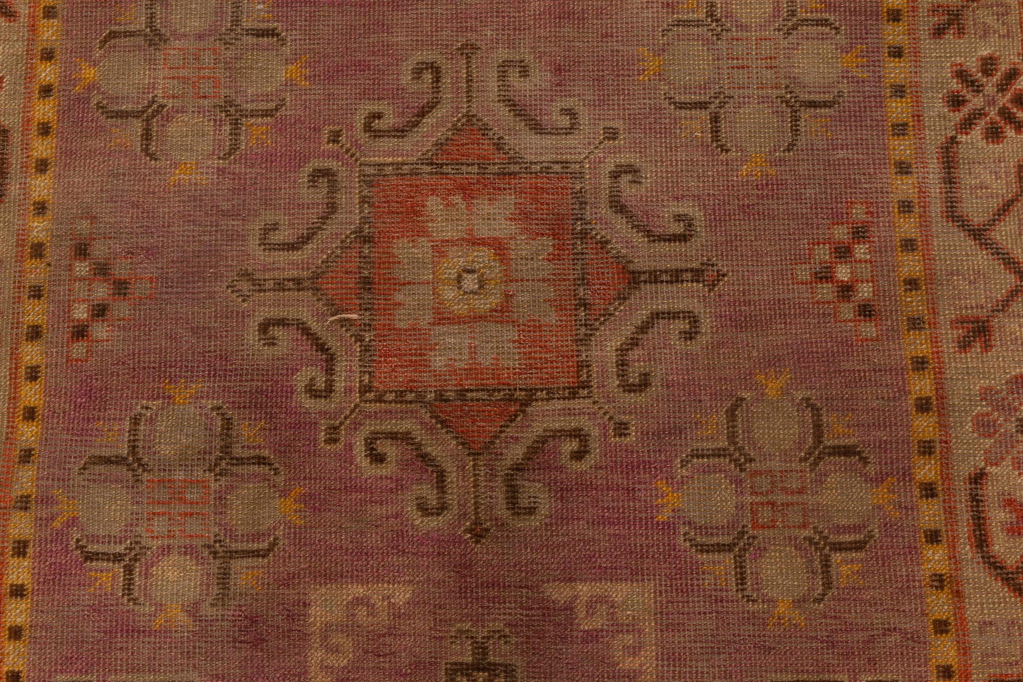 Midcentury Samarkand purple and brown hand knotted wool rug.
Size: 3'4