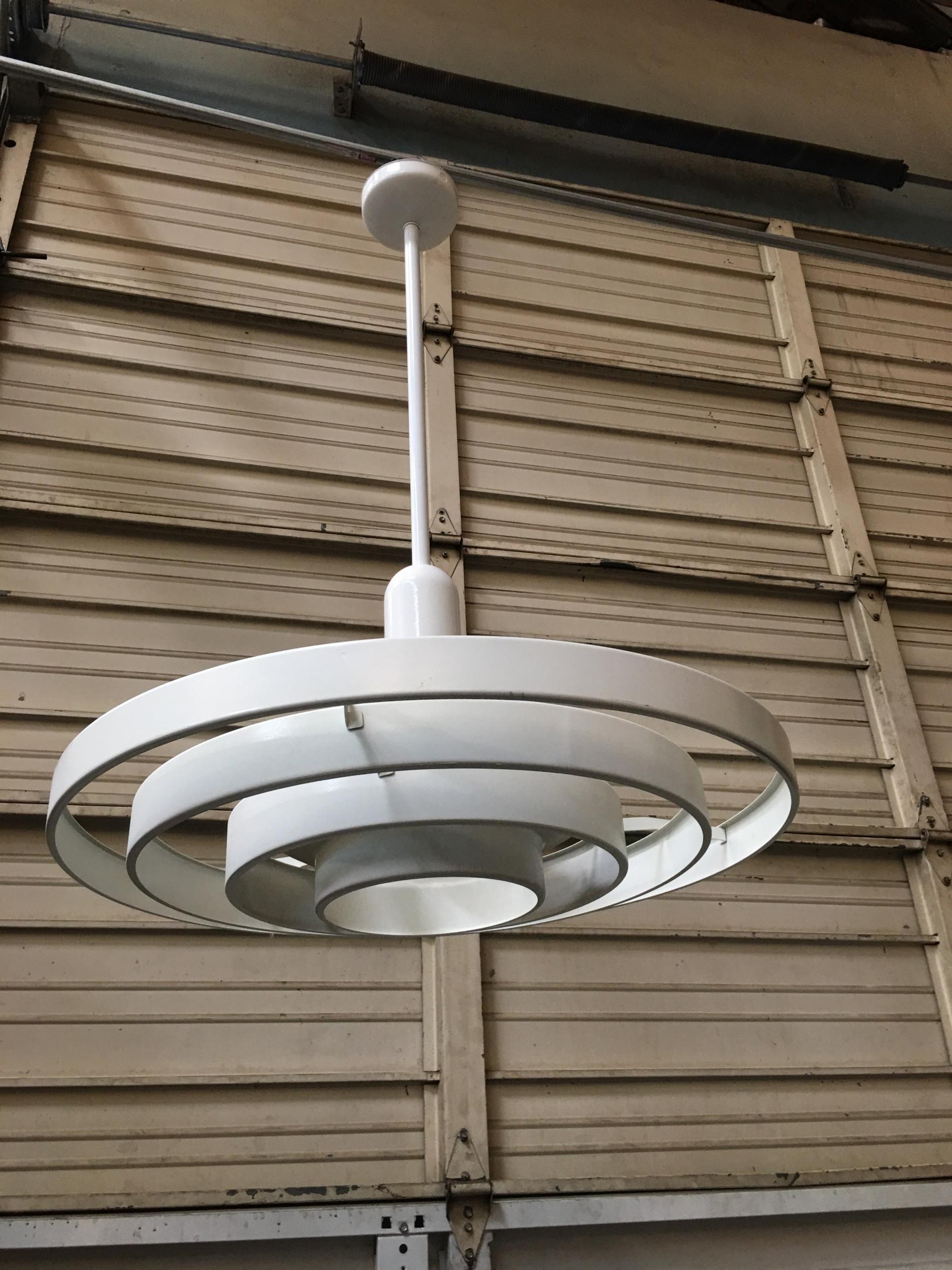 Kurt Versen designed “Saturn“ ceiling light featuring a stacked steel ring light shade suspended by wire to focused light socket. All together this light fixture is 36.5“ tall perfect for large vaulted ceilings.



These pendant ceiling lights