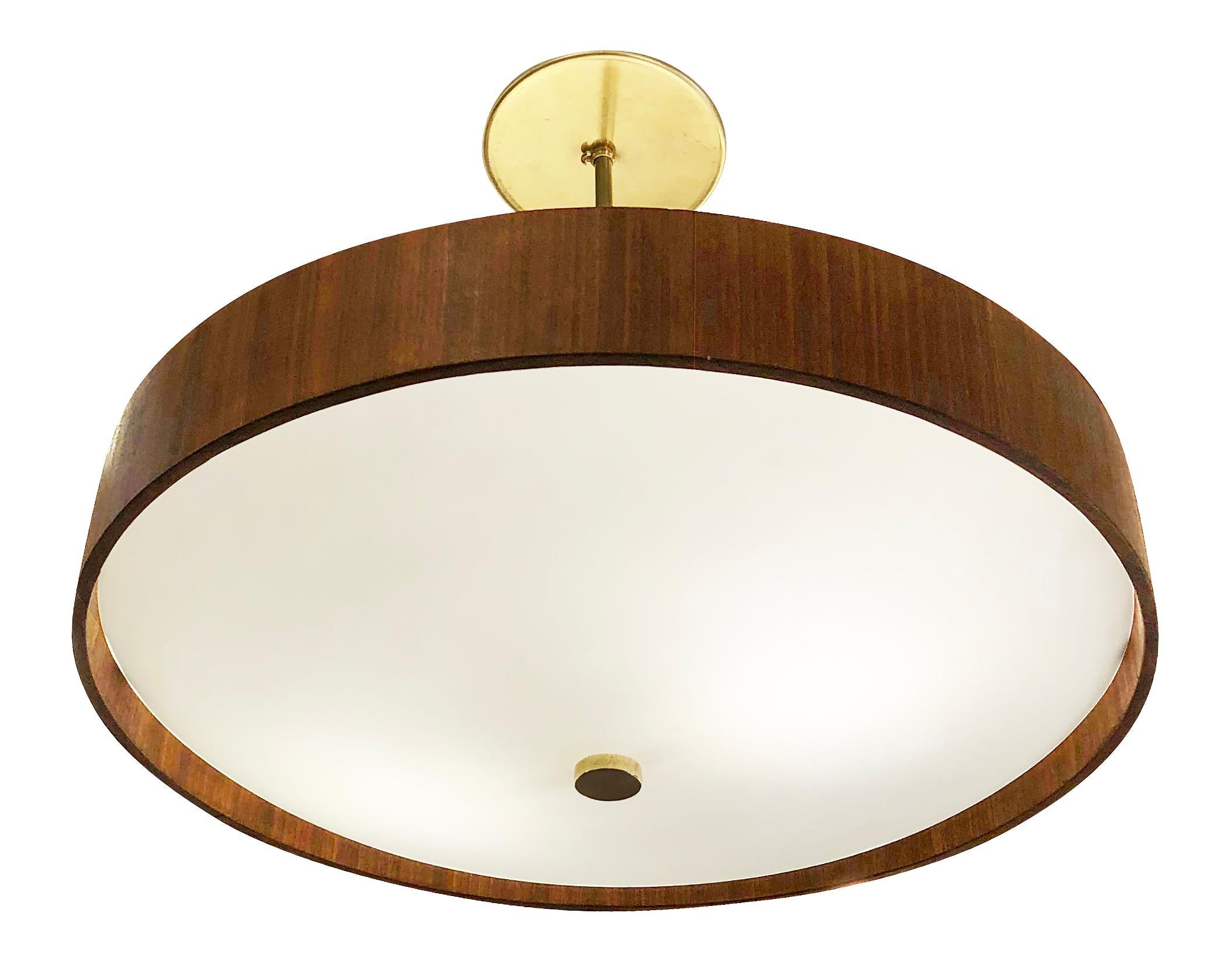 Italian Mid-Century chandelier with a frosted glass shade on the bottom and a white lacquered shade on top joined by a rosewood ring. Hardware is brass. Holds two regular sockets.

Condition: Excellent vintage condition, minor wear consistent with