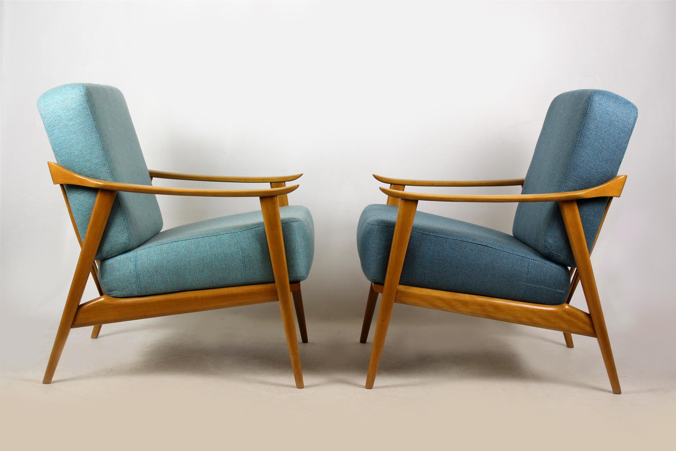 A pair of armchairs from the mid-1960s, made out of beech wood. Feature spring mattresses. Chairs are fully restored (upholstered with new blue and turquoise fabric, satin lacquered woodwork).