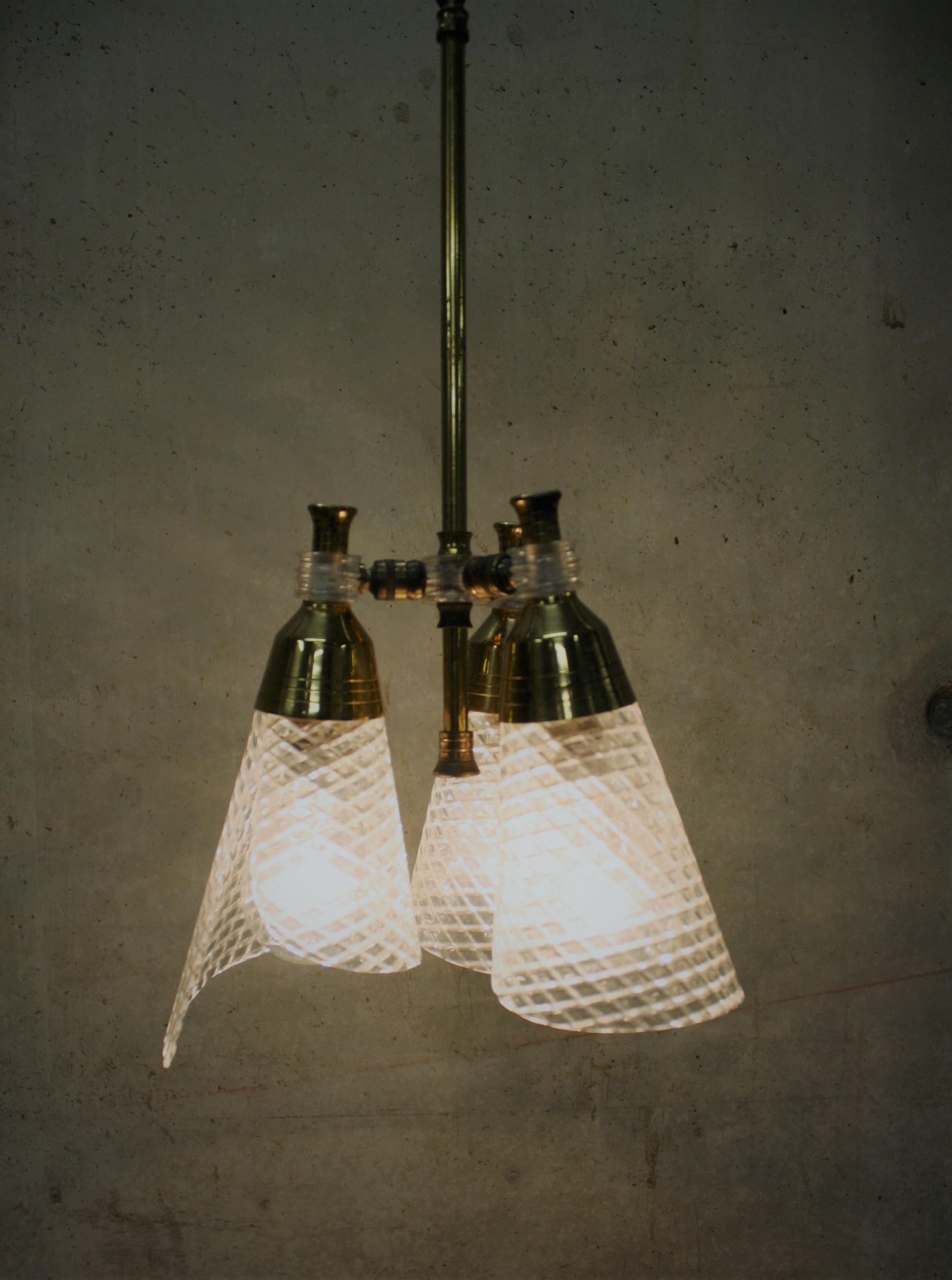 Charming Scandinvavian chandelier. 

The shades are fully adjustable so you can choose what sort of light you have. The chandelier can also be set as an uplighter.

The shades are made of plastic.

1960s, Denmark. 

Very good condition.