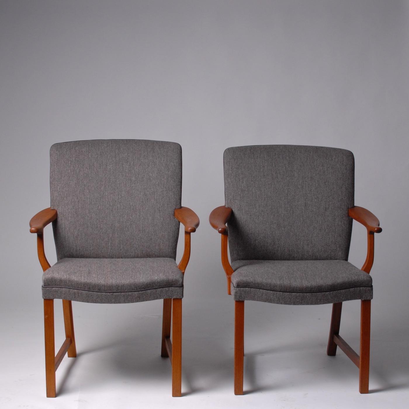 Scandinavian Modern Alf Sture armchairs teak and wool, Norway, 1950.
Armchairs in deep colored grain teak wood designed by Norwegian Architect Alf Sture in the 1950s. Advanced craftsmanship upholstery with blended color gray wool from Kvadrat