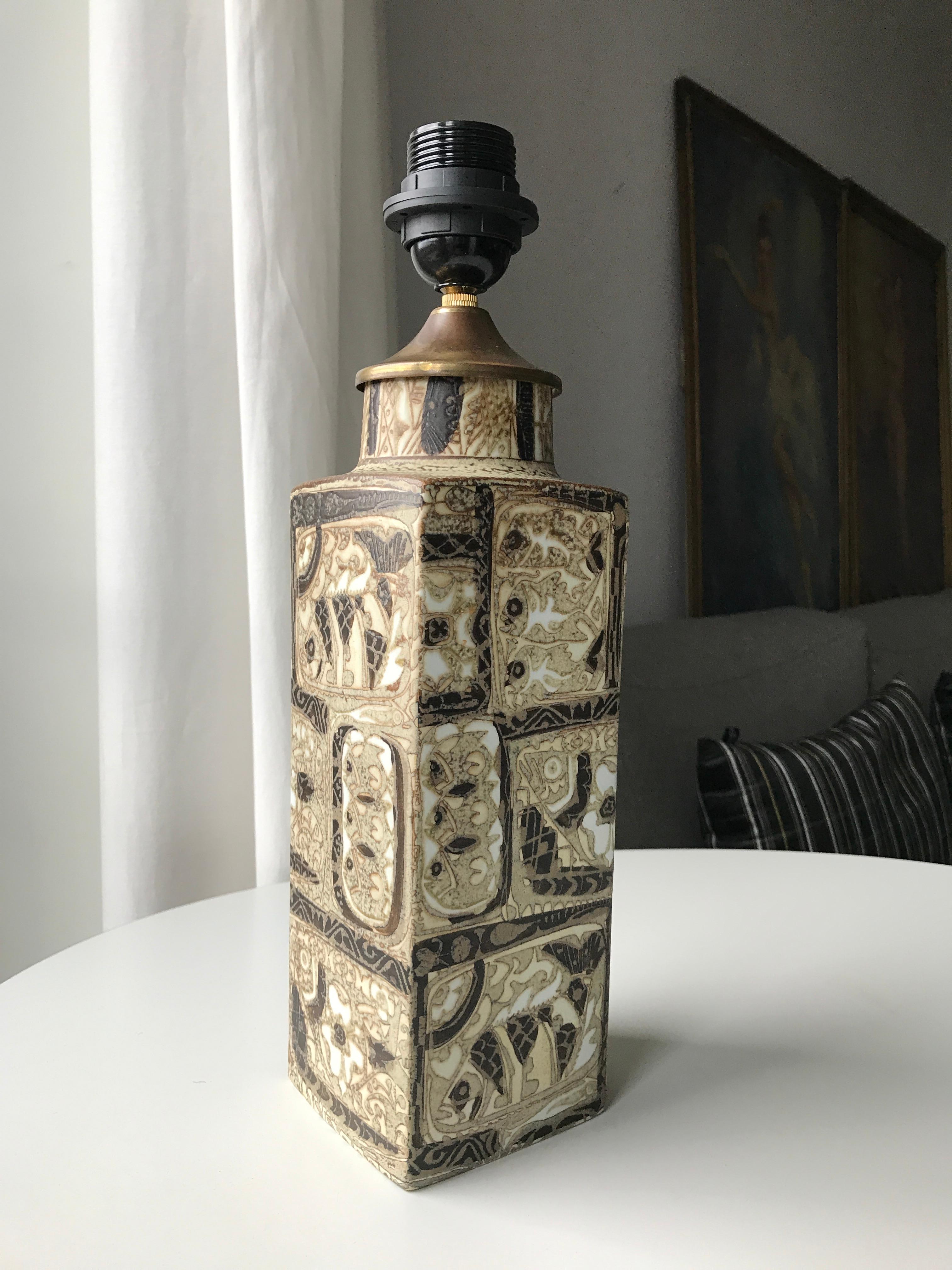 Midcentury Scandinavian Modern Design Baca series grand table lamp designed by Artist Nils Thorsson for Danish Royal Copenhagen Company. The base is made out of stoneware decorated with the typical abstract design from the Baca series with fishes