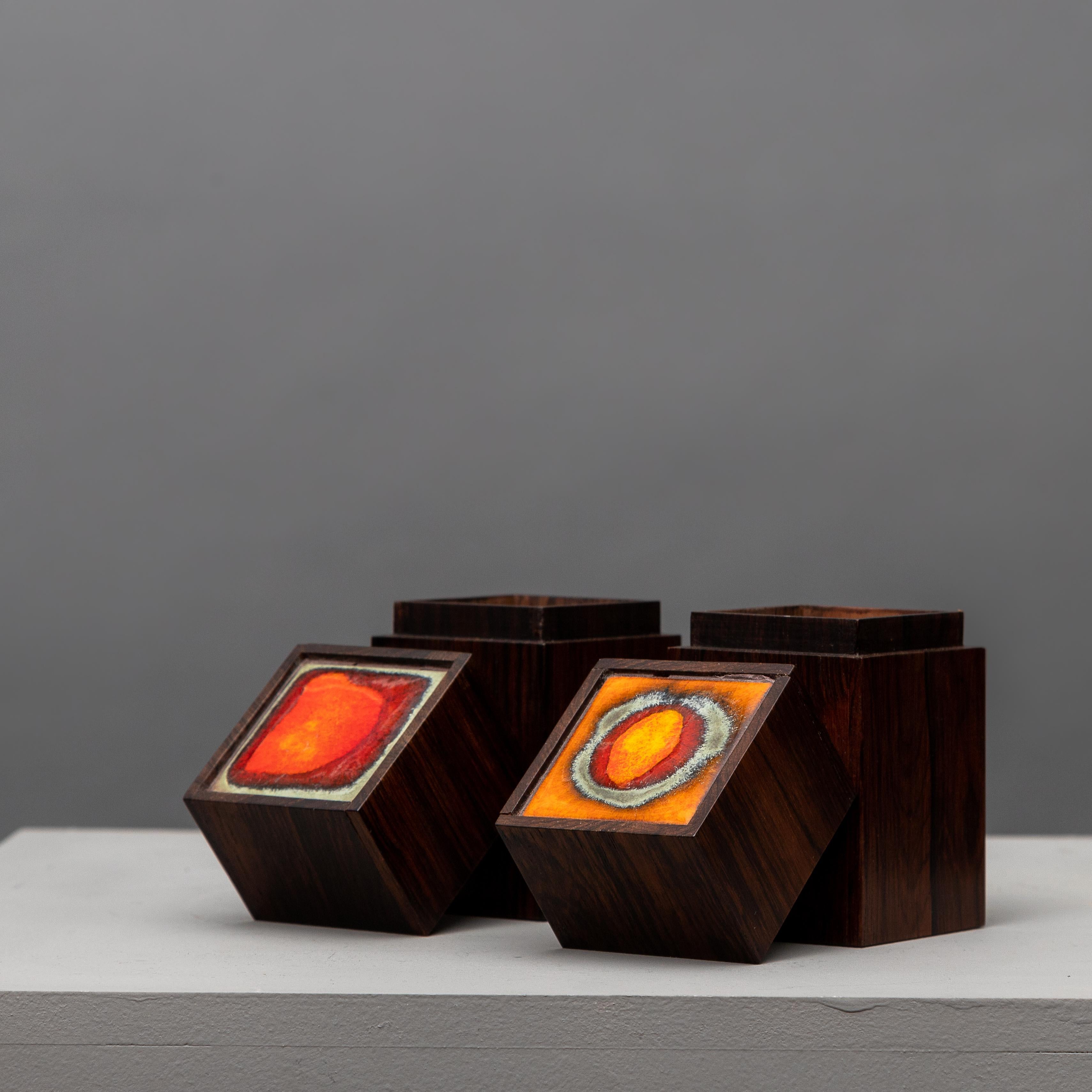 Midcentury Scandinavian manufactured by Klitgaard rosewood cigar boxes 1960s enameled terracotta tiles.
Exquisite boxes from the Danish manufacture Alfred Klitgaard in massive rosewood, decorated with tile with enameled glaze.
 