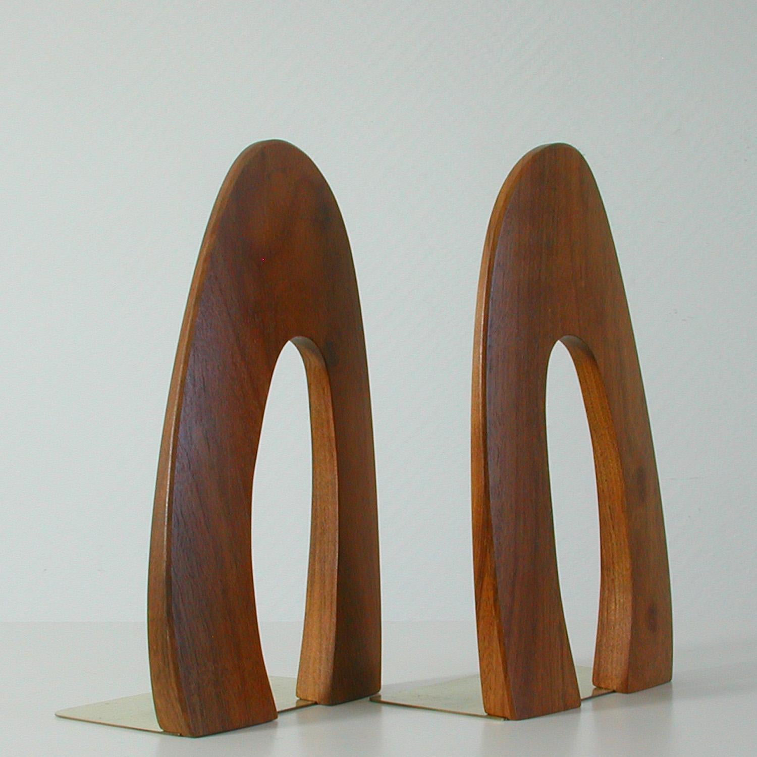These bookends were made in Sweden in the late 1950s-early 1960s. They are made of solid teak and brass and have got an unusual shape.