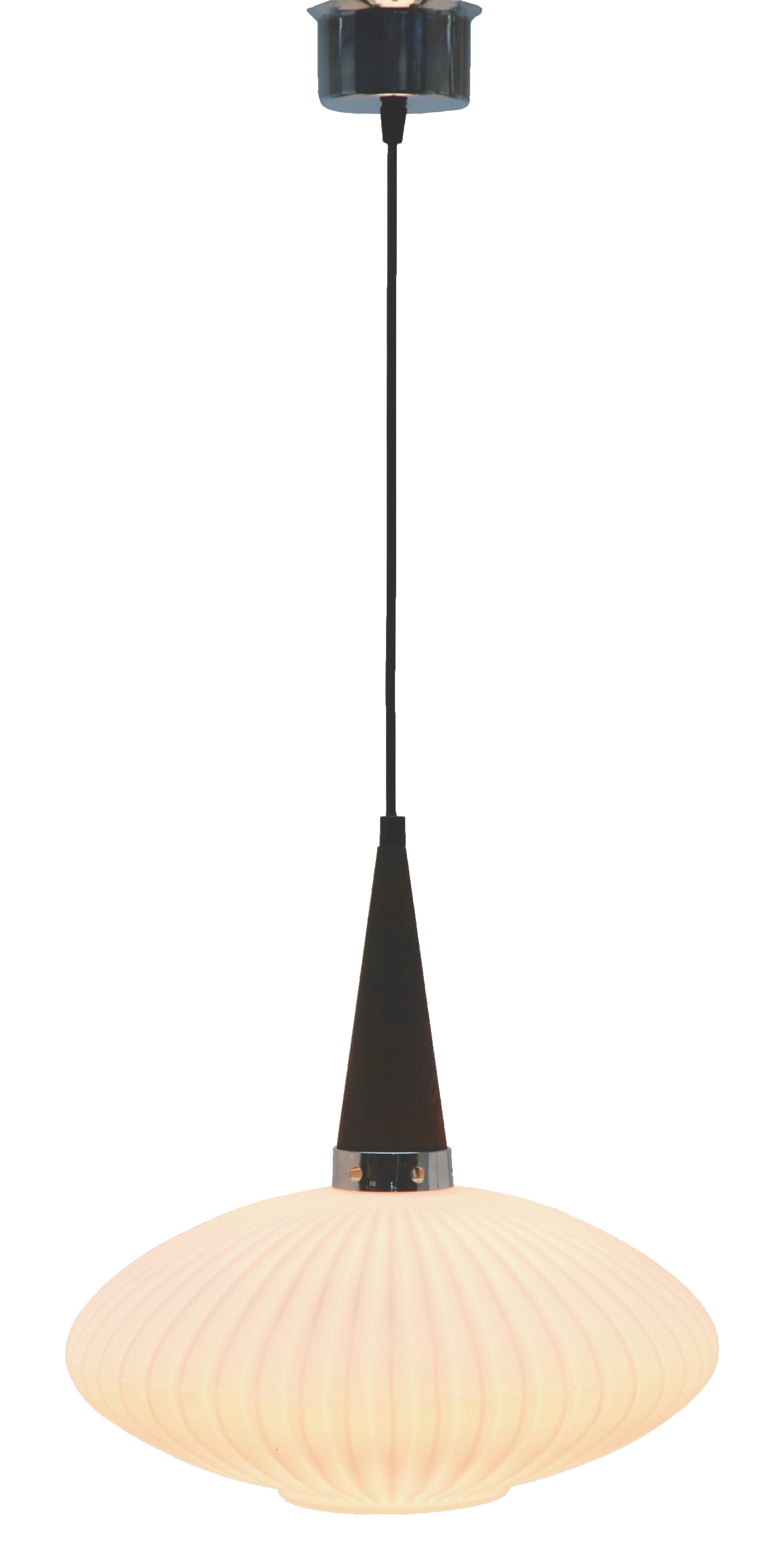 Hanging pendant light from the late 1960s on an adjustable cable, designed in the Scandinavian style with Wenge wood and an opaline shade. Its Classic modernist form and simplicity in design, make it an iconic example of midcentury home