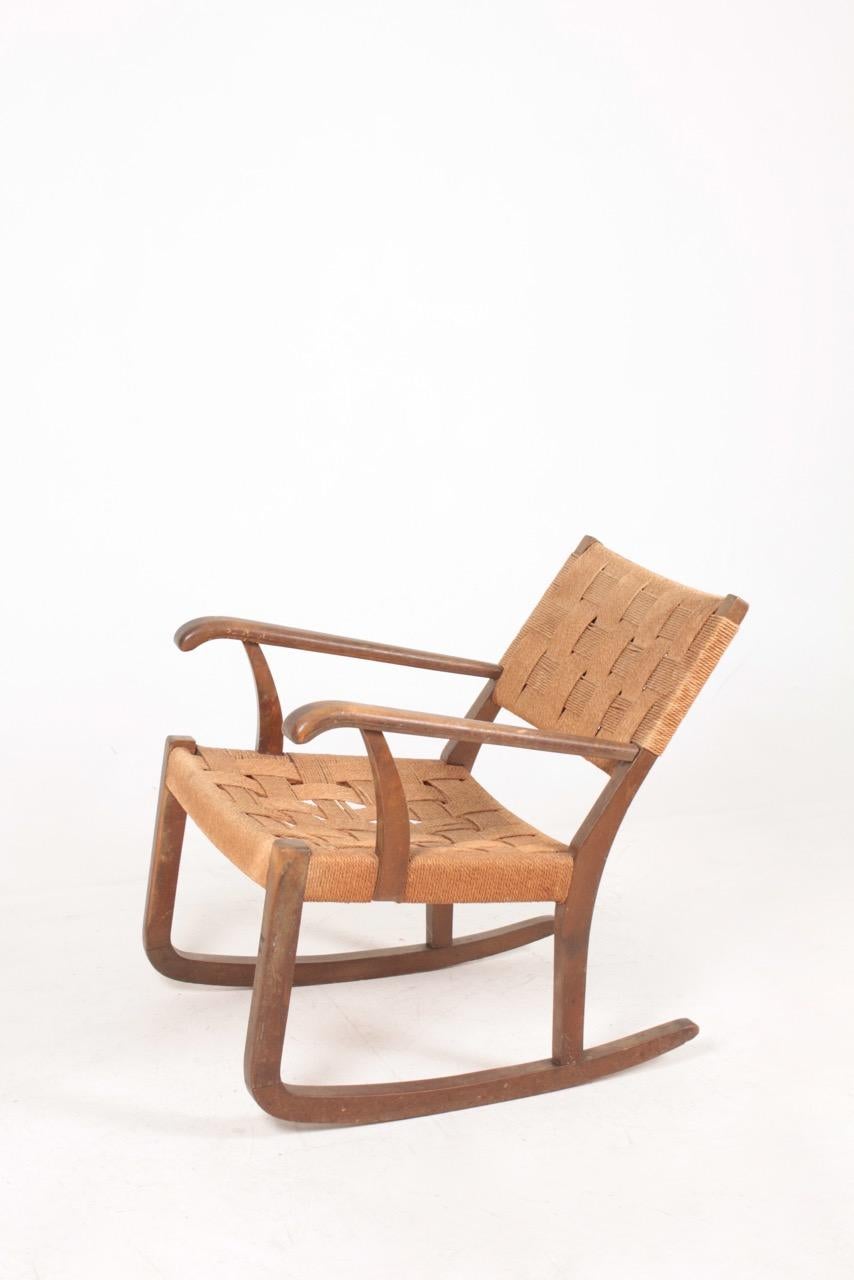 Very comfortable rocking chair, designed and made by Fritz Hansen.