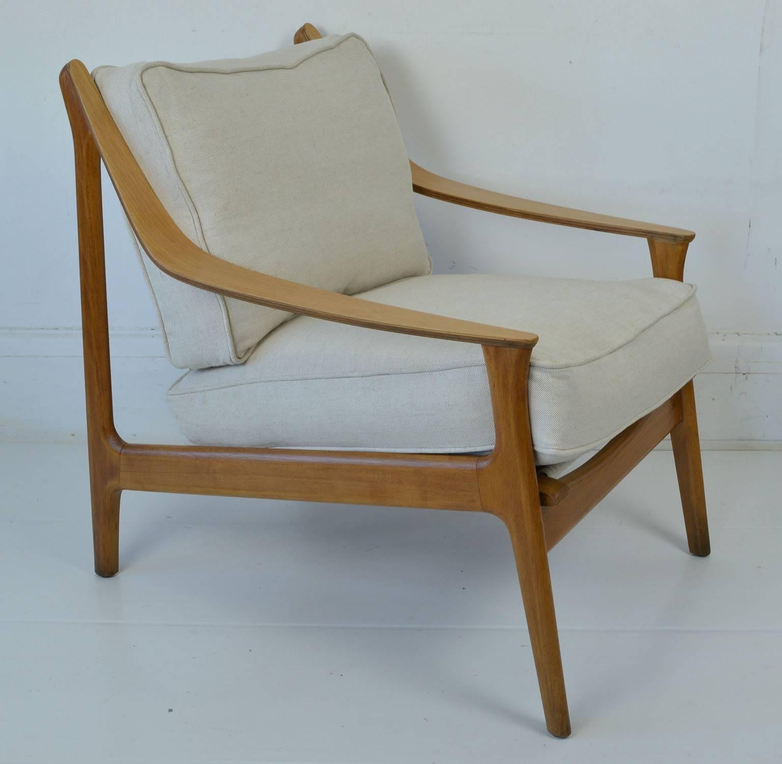 Very stylish chair in Scandinavian style.

The chair is fully marked up to show it was made by the Golden Key Furniture Company, London. 

Probably designed by David Kossoff who worked for the company.

The cushions are not original. They have been