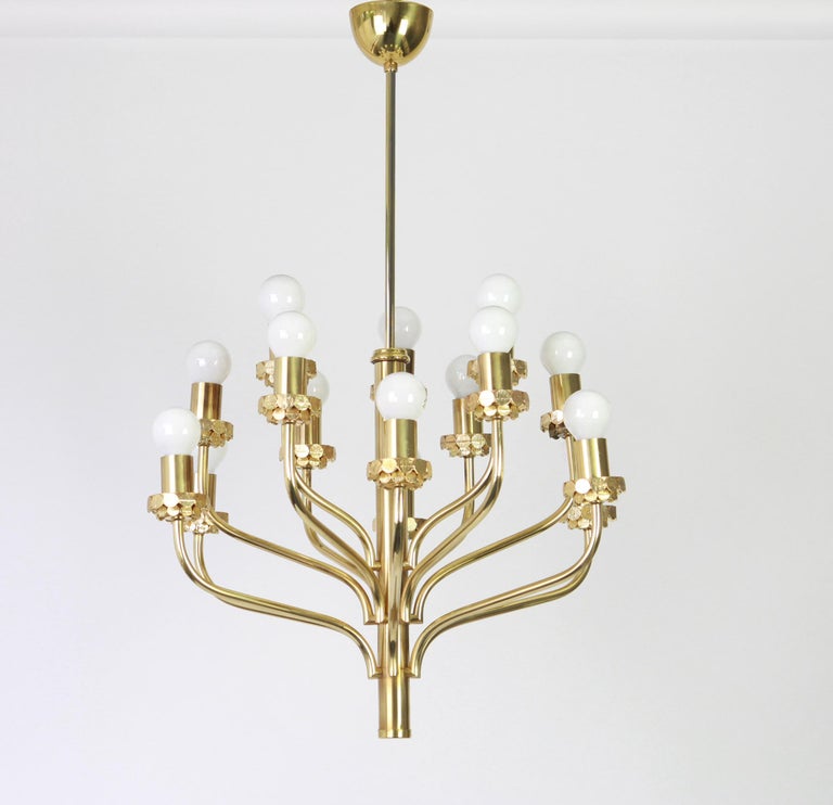 Wonderful midcentury brass chandelier in the manner of Sciolari made by Staff Leuchten, manufactured in Germany, circa 1970s.

Sockets: 15 x E14 small bulbs./ max. 40 watt each-
Good condition.

Measures: H 85 cm, 33.46 inch //Drop rod can be