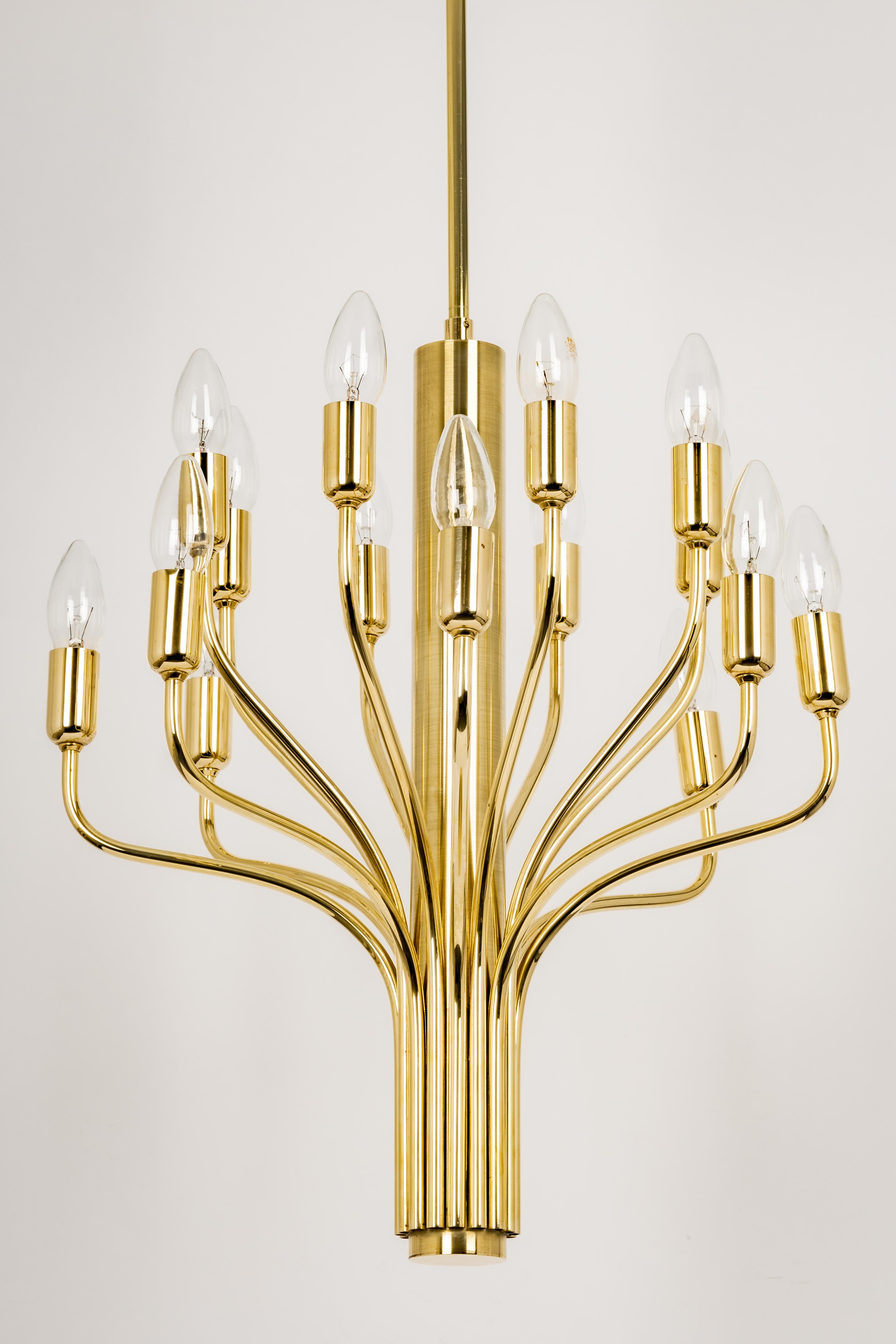 Wonderful midcentury brass chandelier in the manner of Sciolari made by Staff Leuchten, manufactured in Germany, circa 1970s.

Sockets: 16 x E14 small bulbs./ max. 40 watt each-
Light bulbs are not included. It is possible to install this fixture