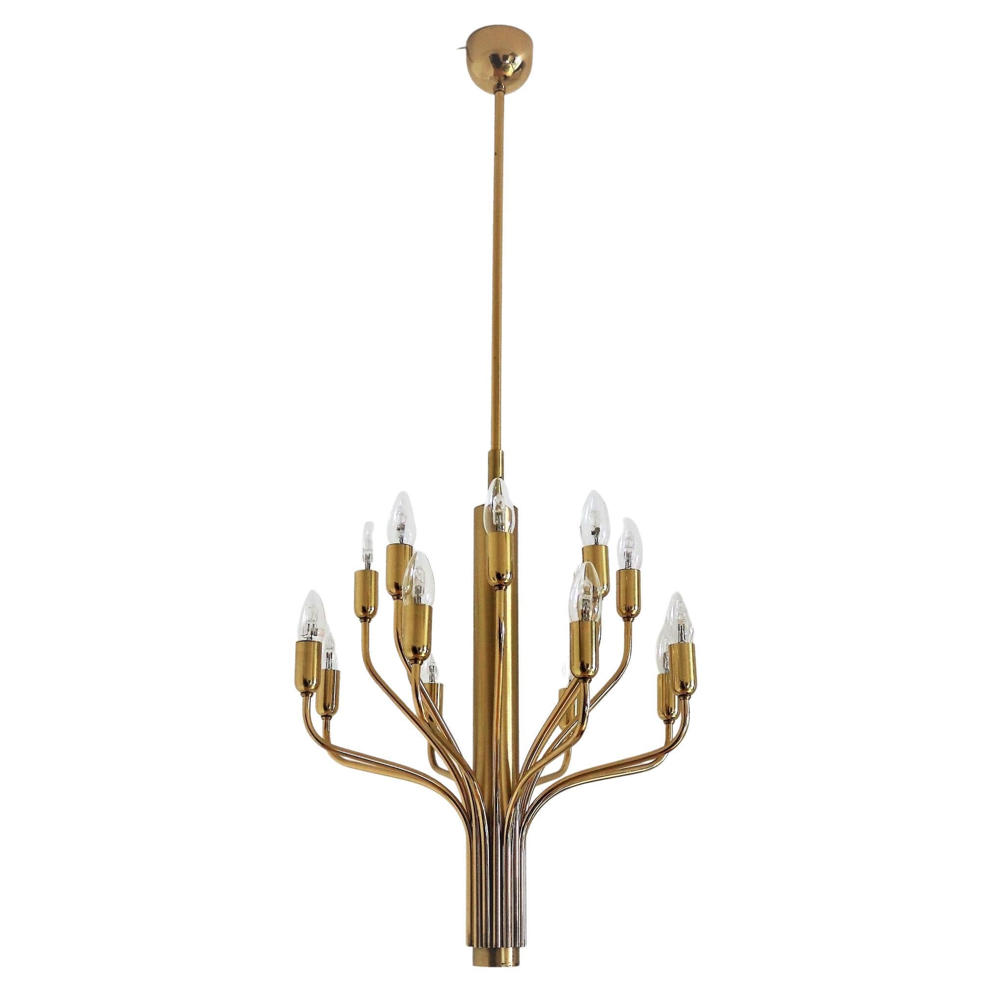 Gorgeous mid-century brass chandelier in the manner of Sciolari made by Staff Leuchten, manufactured in Germany, circa 1970s.
The chandelier is made of full brass and has a long brass rod to ceiling.
Excellent craftsmanship.
Very good working