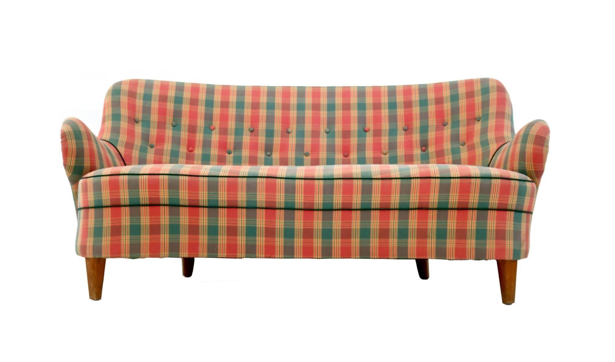 This sofa has been recently reupholstered.
It is a vintage item, therefore it might show slight traces of use: it had a slight cut, which has been mended and it is now imperceptible, and overall, is in good original condition.
 
Measures: Width