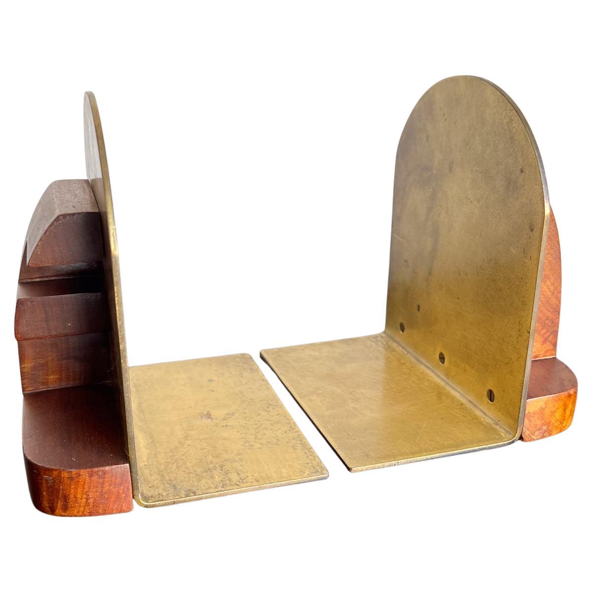 AMBIANIC presents: Vintage modern pair of bookends brass and wood
No maker information
6 w x 5.5 d x 6.75 h
Original vintage condition
Refer to images