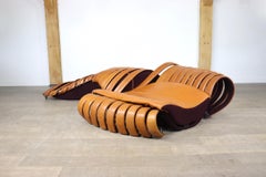Midcentury Sculptural lounge sofa in cognac leather, France 1980s