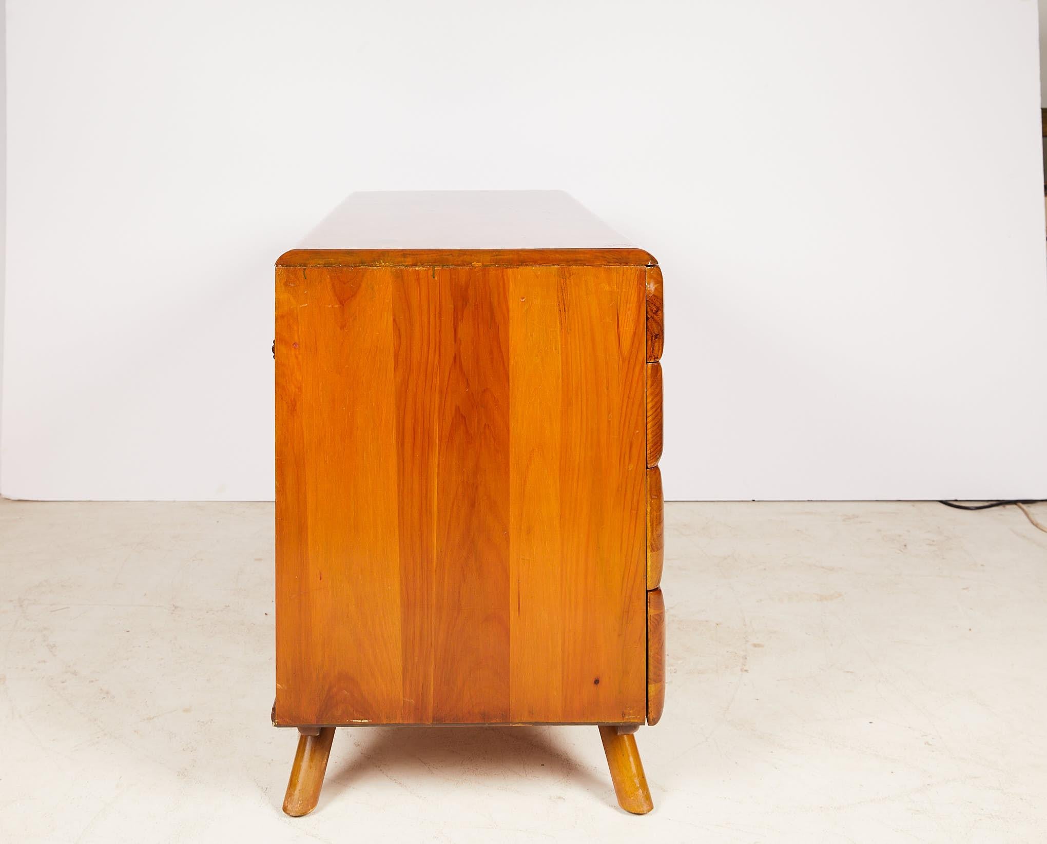 Mid-century Franklin Shockey atomic age nine drawer pedestal desk with brass hardware. The desk is made of solid wood and a part of the sculptured pine series. It features sleek rounded corners and is finished on all sides.