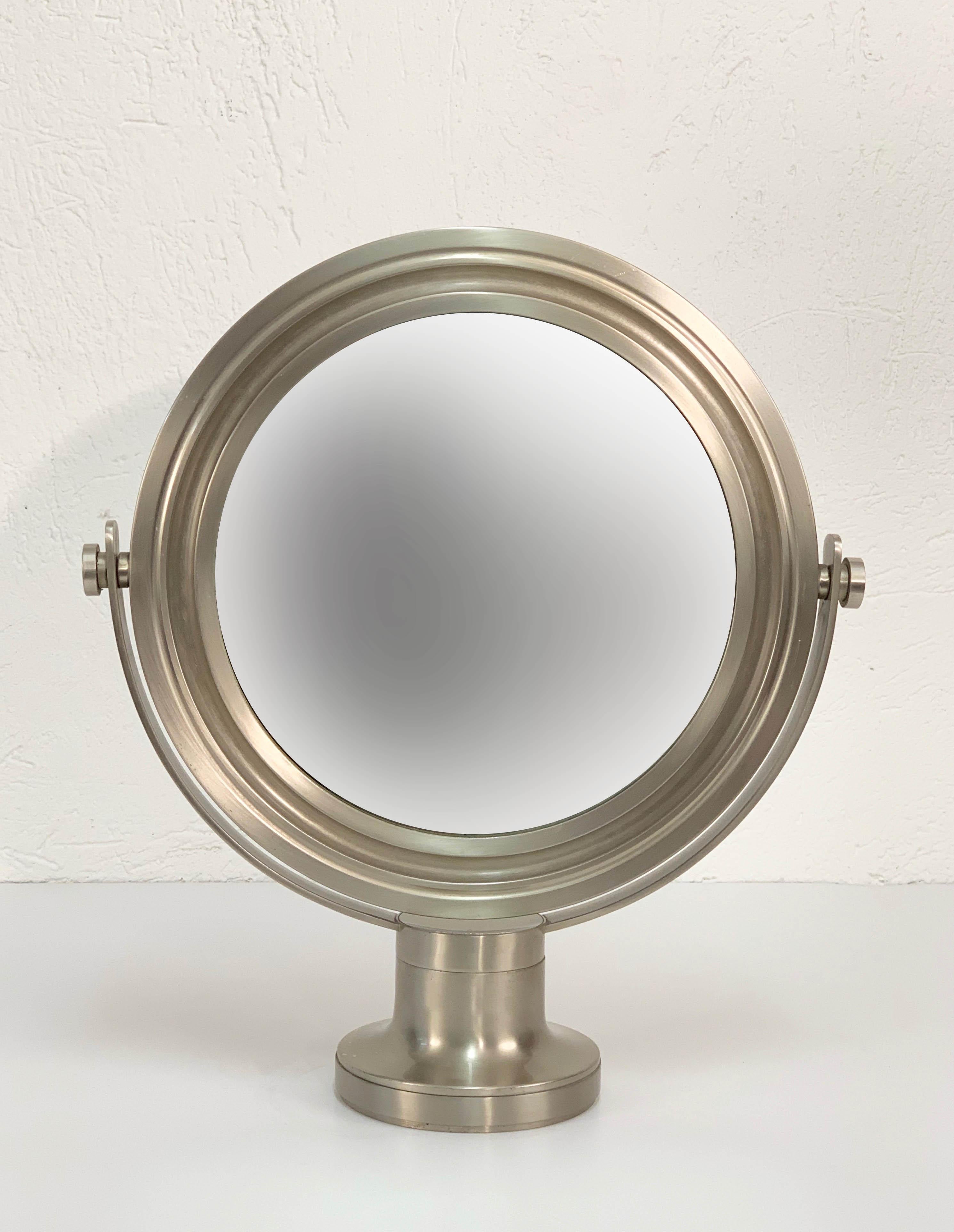 Sergio Mazza midcentury table mirror in brass and nickel for Artemide, produced in Italy during 1960s.

This astonishing piece is composed of a revolving nickel-plated and sterilized brass mirror on a small base. The condition is excellent as the
