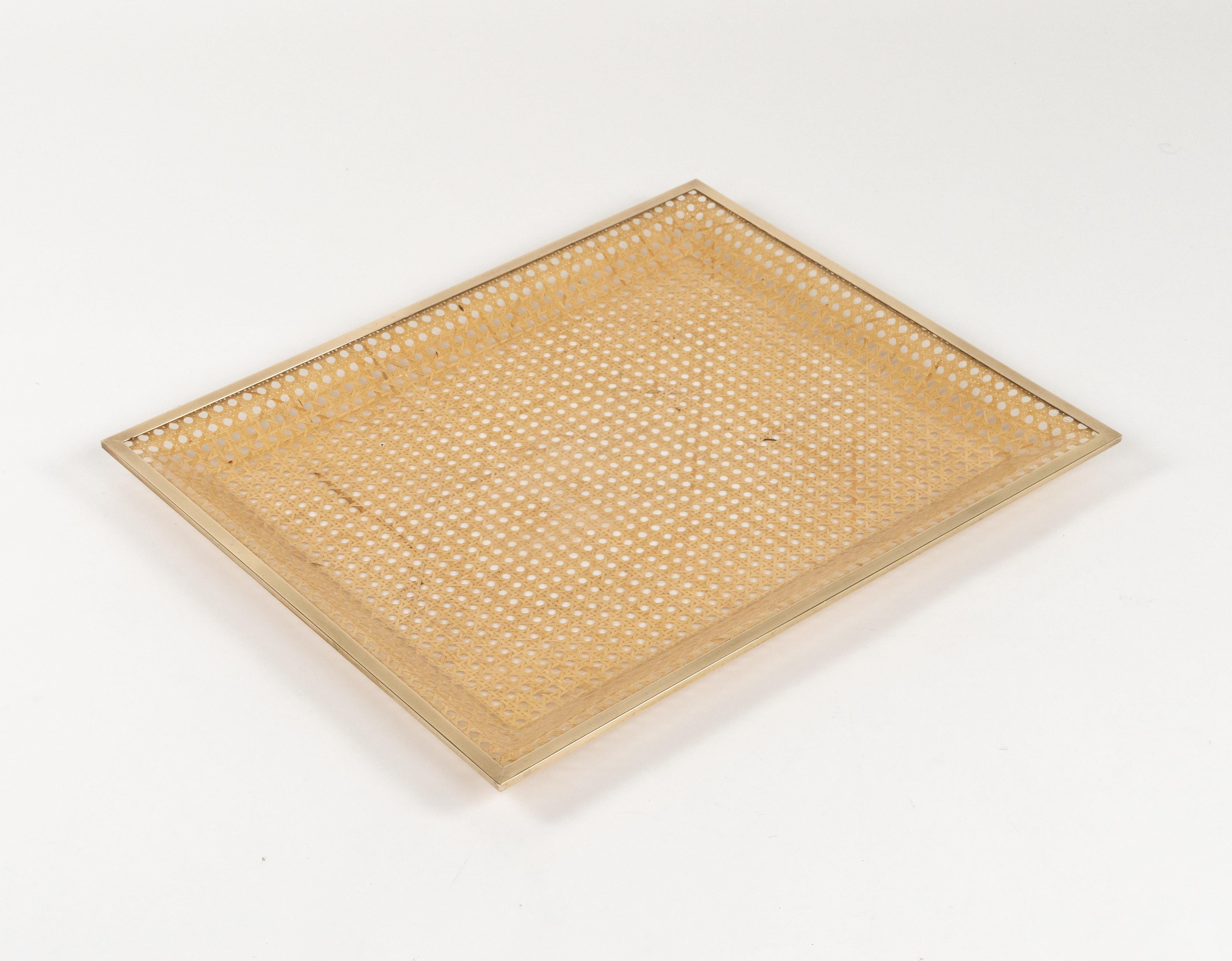 Midcentury amazing large rectangular serving tray or centerpiece in lucite, rattan and brass in the style of Christian Dior Home.   

Made in Italy in the 1970s.   

Great accessory for any modern interior.