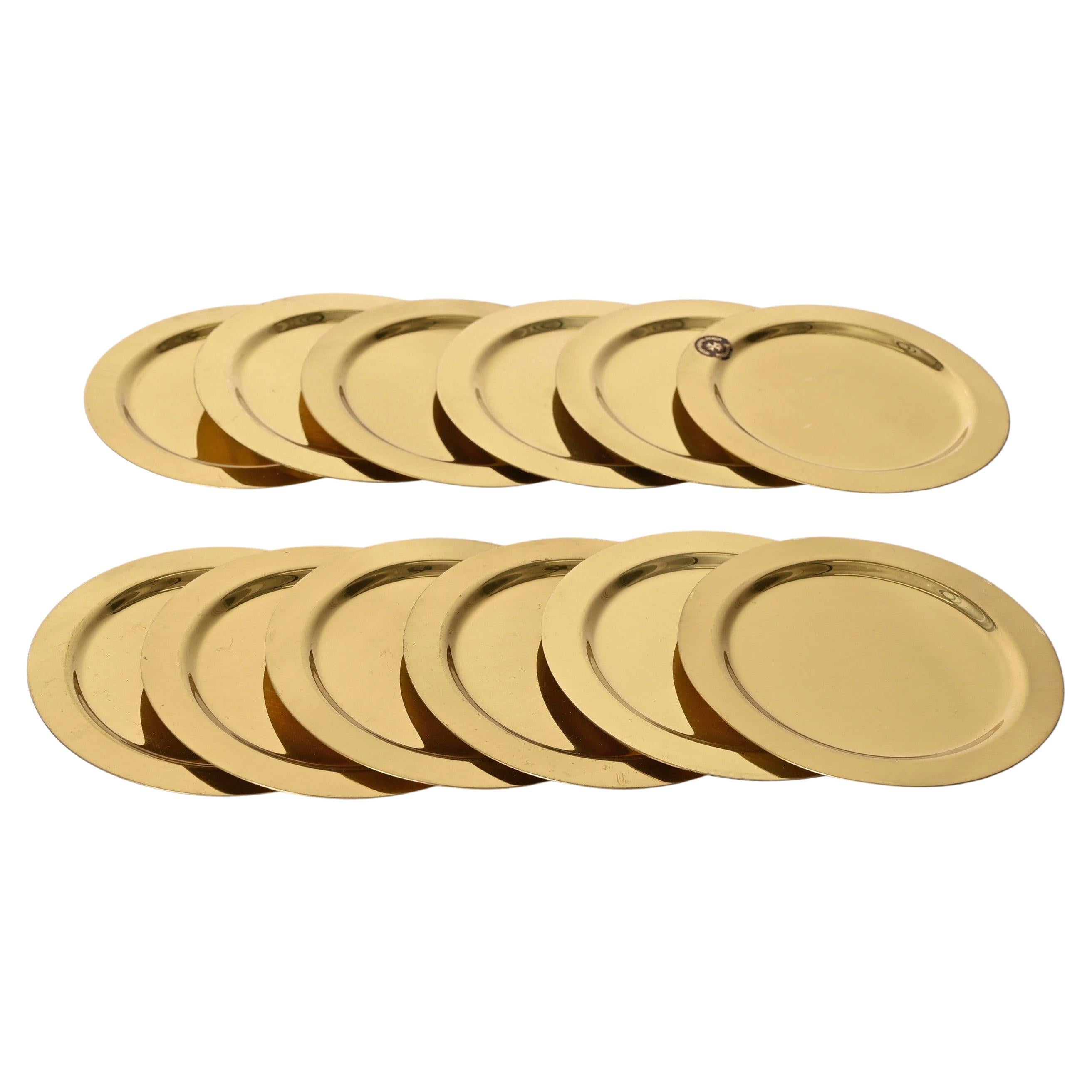 Amazing set of 12 mid-century brass coasters. This set was made in Italy during the 1980s.

This set is fantastic because of the purity of the lines and the clean, pure use of the material in combination with the shape.

An elegant set that will