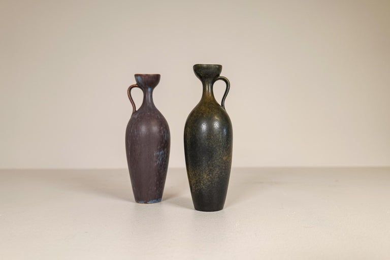 Two wonderful ceramic vases made in Sweden during the 1950s at Rörstrand factory and designed by Gunnar Nylund.

The vases match each other and gives a clean and modern look. They are nicely sculptured and have a nice glaze.

Good condition.