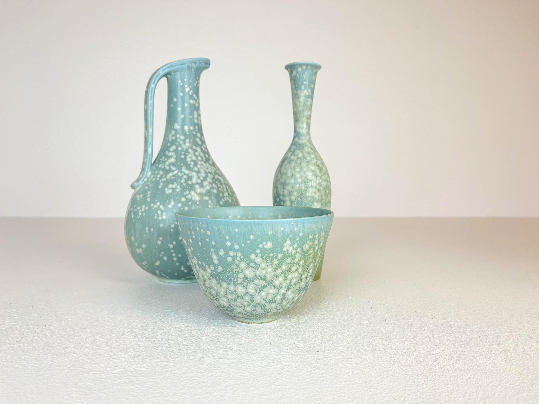 Three wonderful pieces, two vases and one bowl from Rörstrand and maker, designer Gunnar Nylund. Made in Sweden in the midcentury. Exceptional glazed vases with wonderful curves. This set of three are rare to come by. 

Good