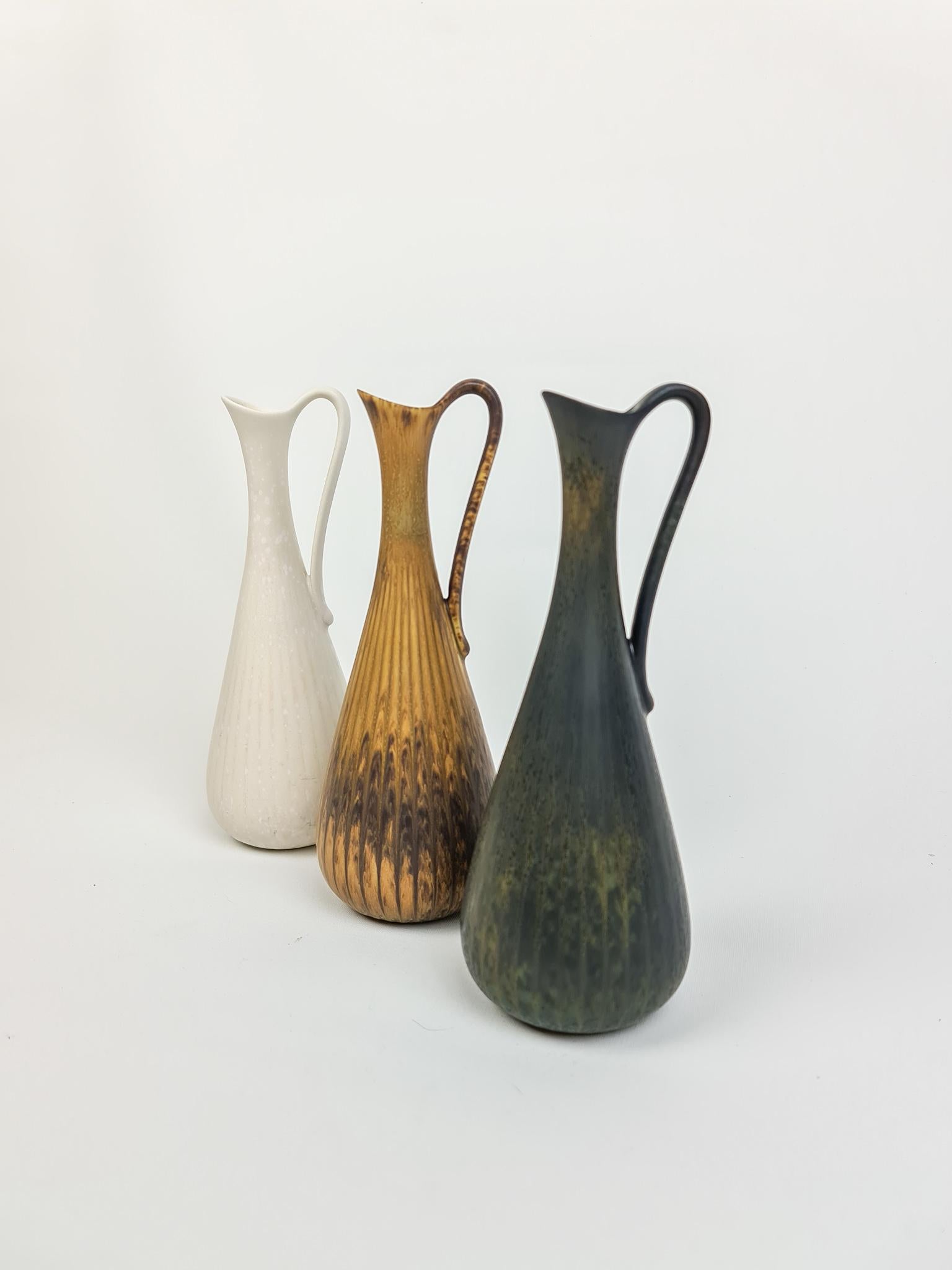 Three wonderful vases from Rörstrand and maker, designer Gunnar Nylund. Made in Sweden in the midcentury. Beautiful glazed vases in good condition.

Measures: Height 20 cm, 7.9 in diameter 7 cm / 2.8 in.
  