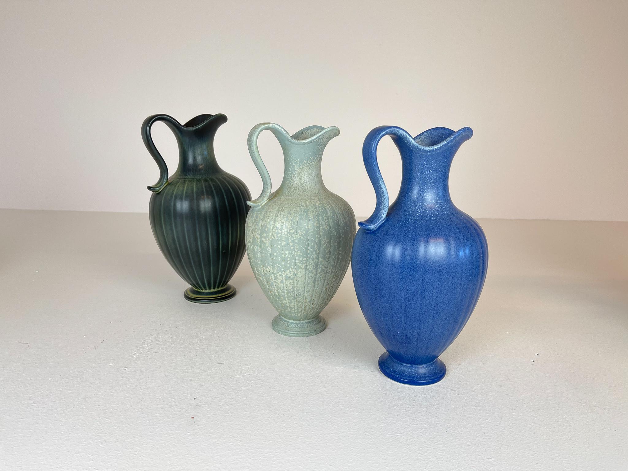 Three wonderful vases from Rörstrand and maker/Designer Gunnar Nylund. Made in Sweden in the midcentury. Beautiful, glazed vases with wonderful sculptured forms.

Good vintage condition.

Dimensions: H 28 cm, W 17 cm D 13 cm.
  