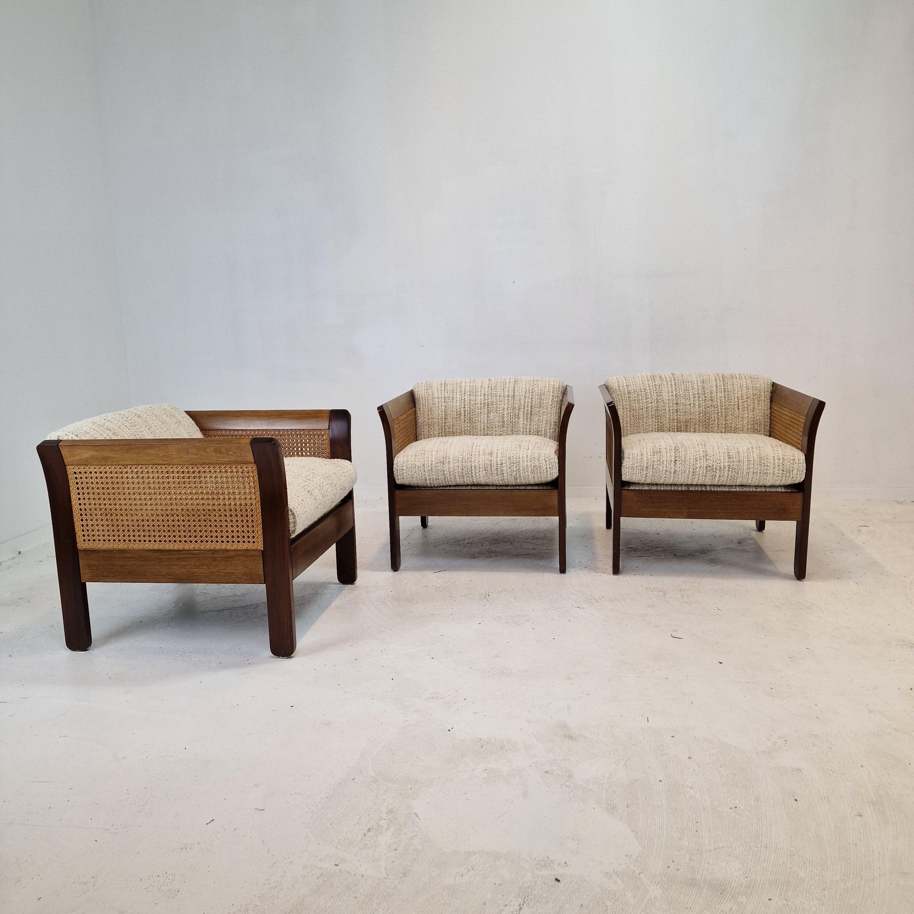 Lovely set of 3 Club or Lounge Chairs, designed and fabricated in the 60's in Italy.

The beautiful structure of these comfortable chairs is made of solid wood and rattan. it is a stunning combination.

The chairs are just restored with new