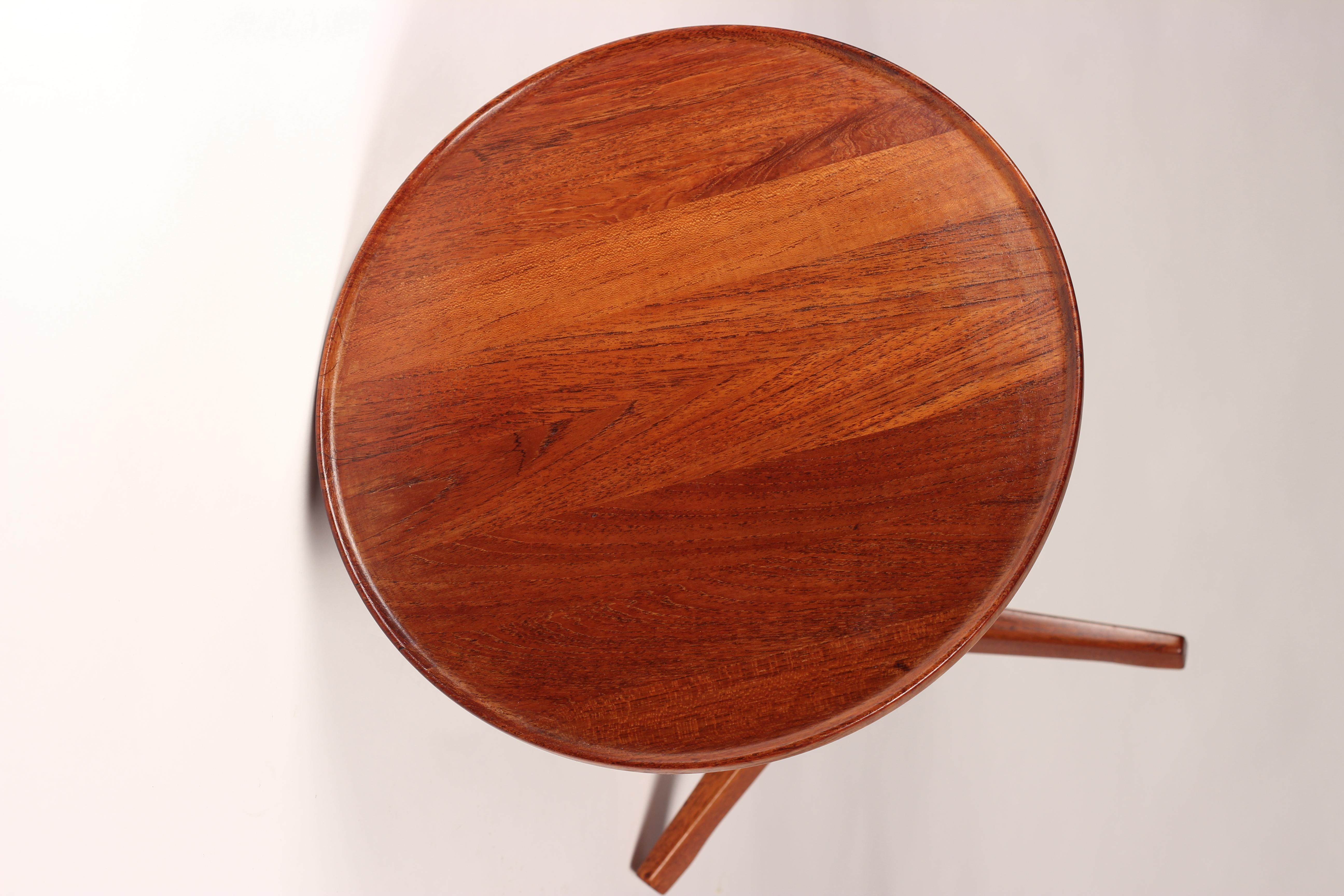 Four versatile Mid-Century Modern Danish side tables that we now have currently in store. Professionally restored oiled and waxed. These tables are practical and functional and are simple to ship, with the teak tops, legs and star bases all