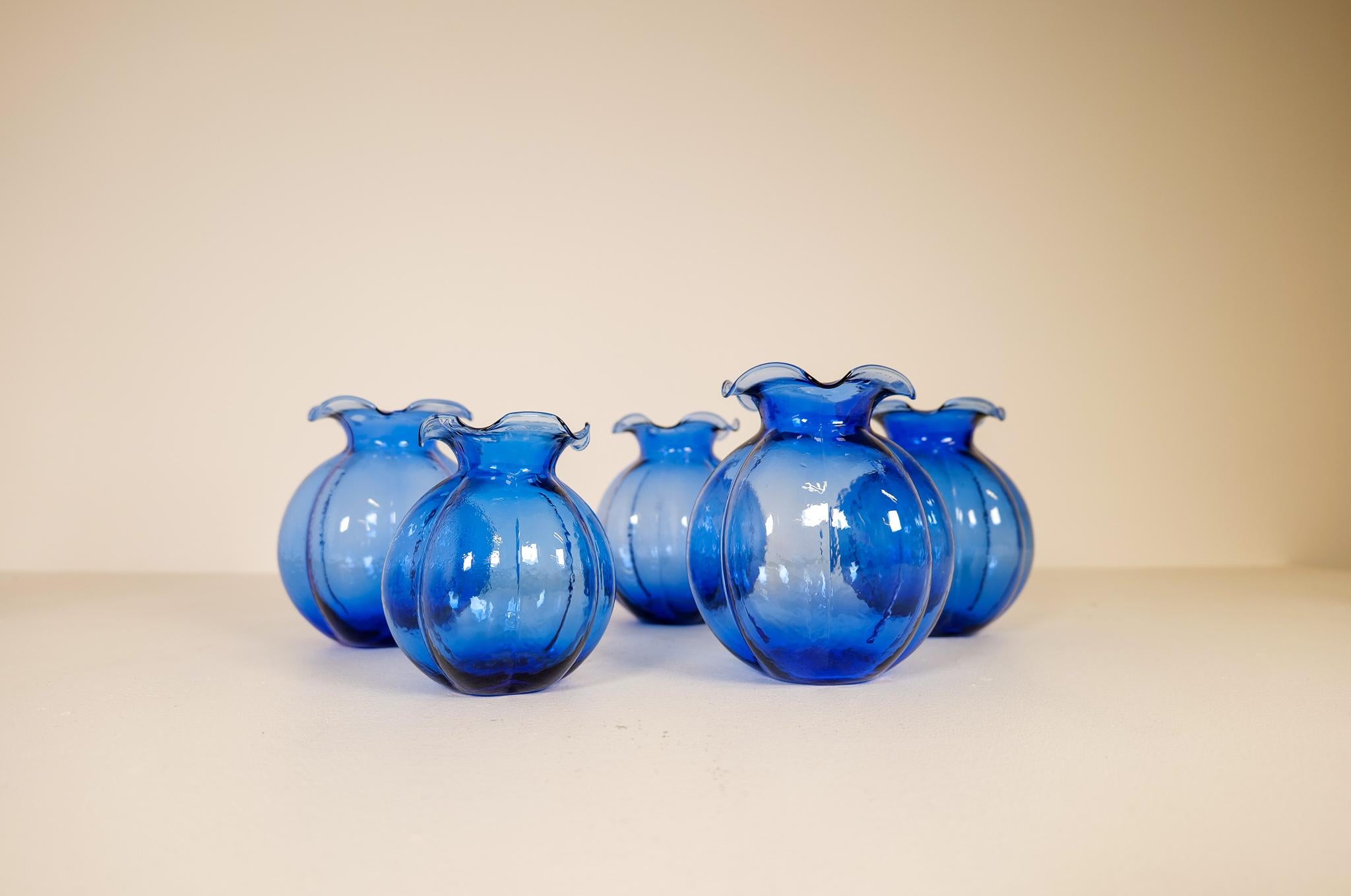Wonderful shaped vases with a nice blue color are these 5 vases. They are made in Johansfors glass factory Sweden in the 1950s. 

Good condition.

Measures: 4 big one’s H 20 cm D 15 cm 1 smaller H 16 D 14.
 