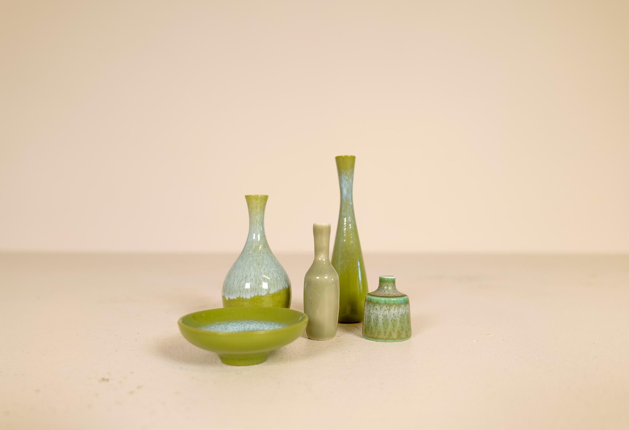 Set of five wonderful miniature vases from Rörstrand and maker/Designer Gunnar Nylund and Stålhane. Made in Sweden in the mid-century. Beautiful, glazed vases in good condition. 

Measures: height 13 cm to 4 cm in height.
 