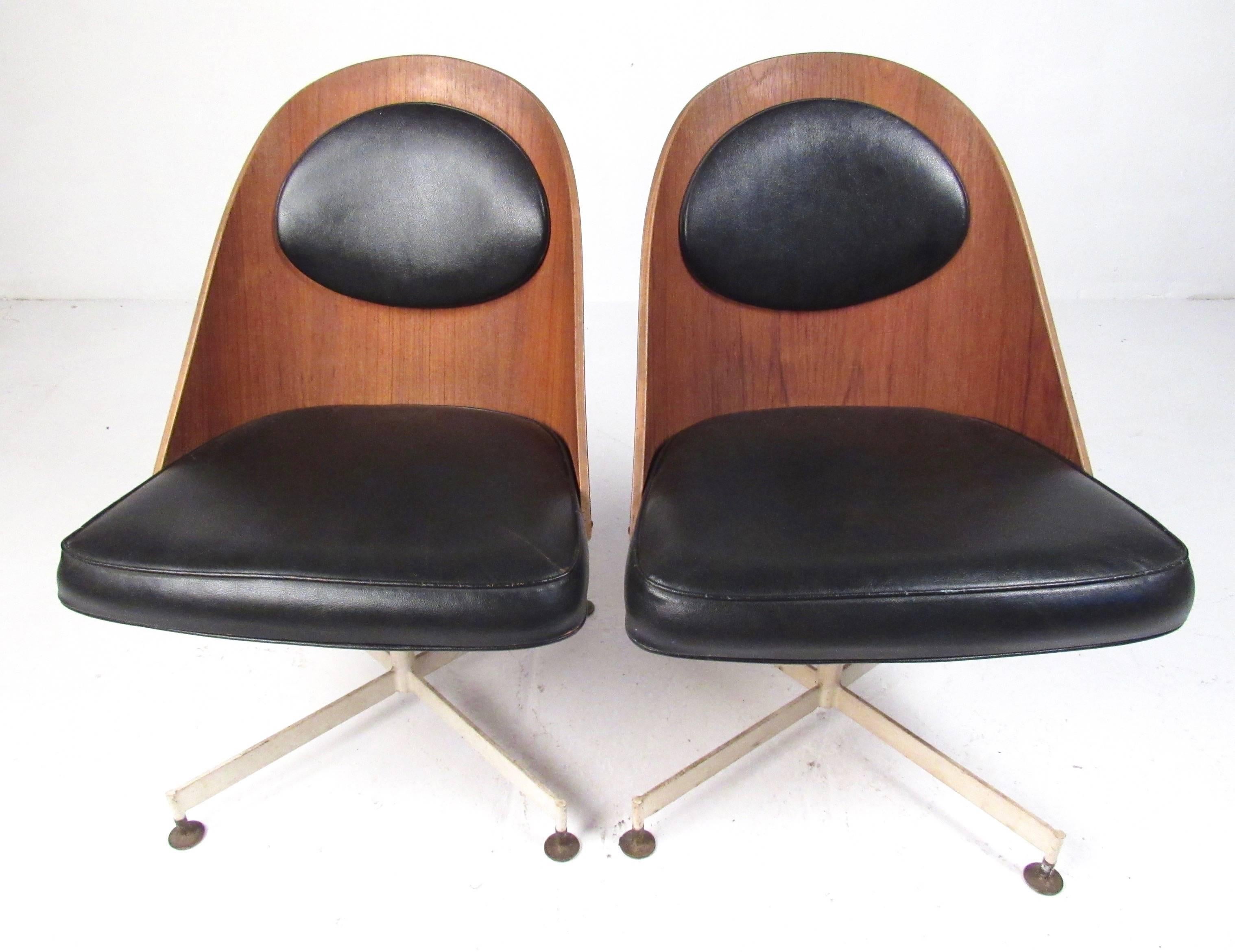 This vintage modern desk chair features swivel metal base and shapely bentwood seat back. Unique mid-century modern style makes this a stylish addition to any home or office as a desk or side chair. Note: Price is for one chair, two available.