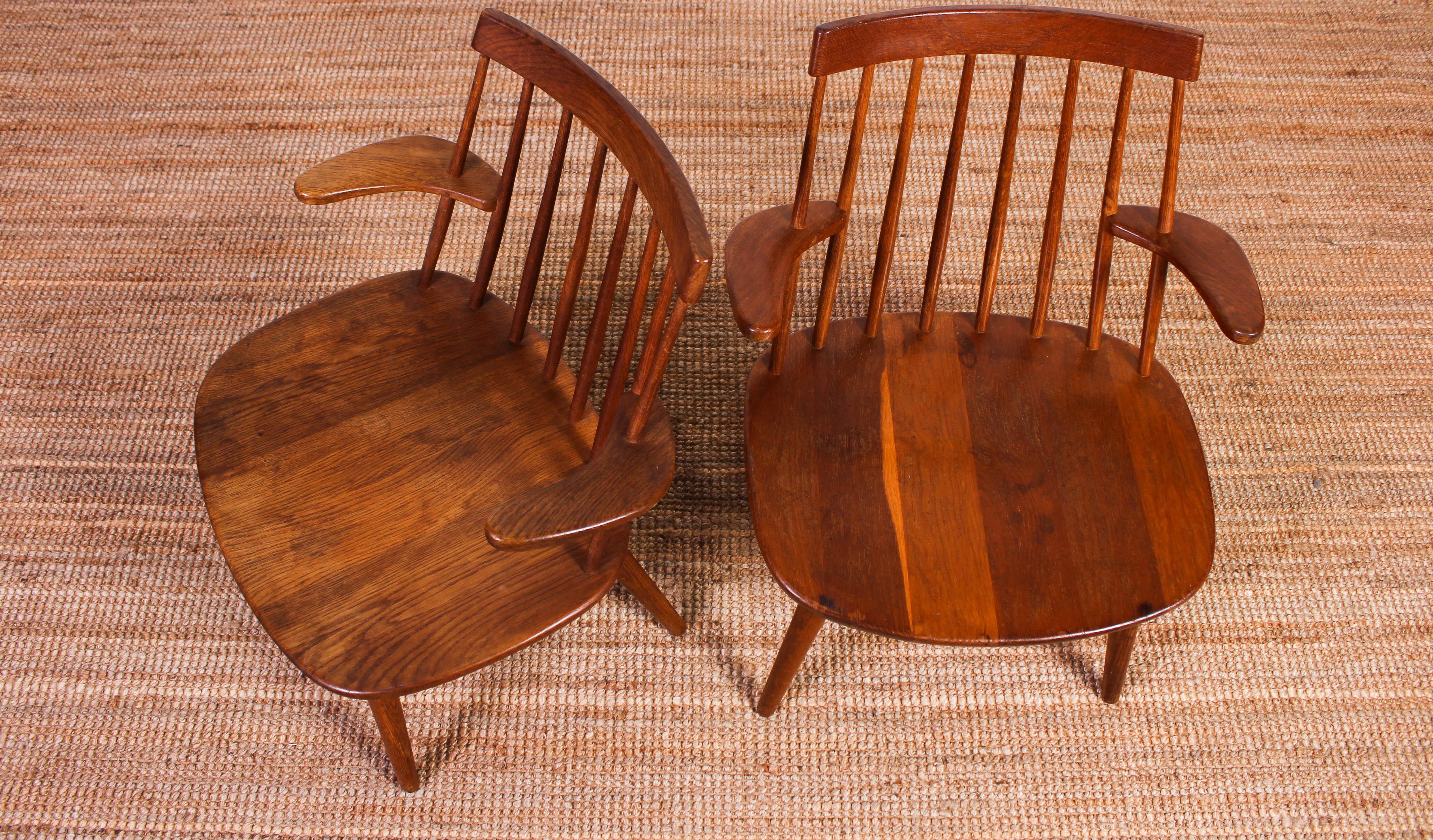 Midcentury armchairs made by smoked oak, designed by Swedish designer Yngve Ekström. The chairs are in good vintage condition with signs of usage and patina but no structural damages.