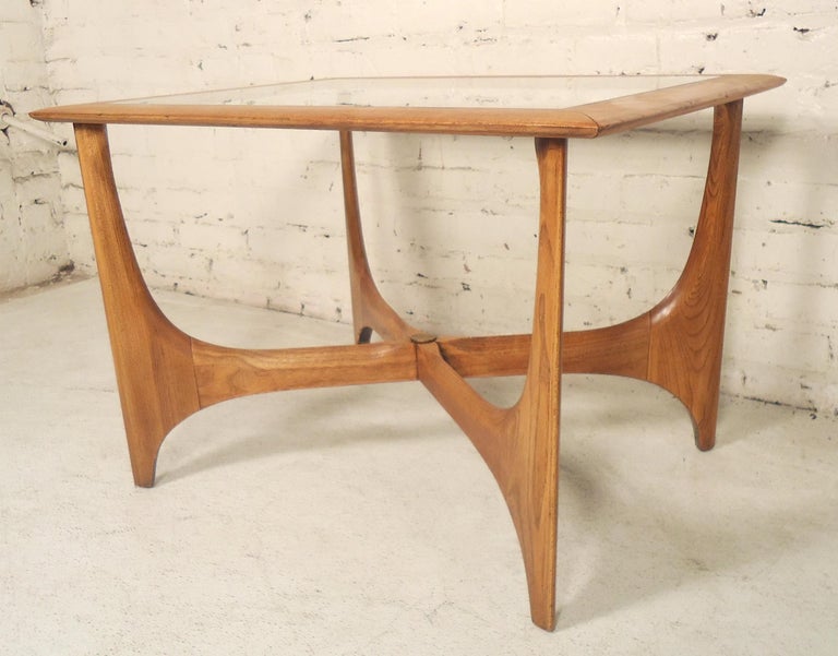 Well designed walnut side table with glass insert. Attractive X-style base and curved legs.

(Please confirm item location - NY or NJ - with dealer). 
 