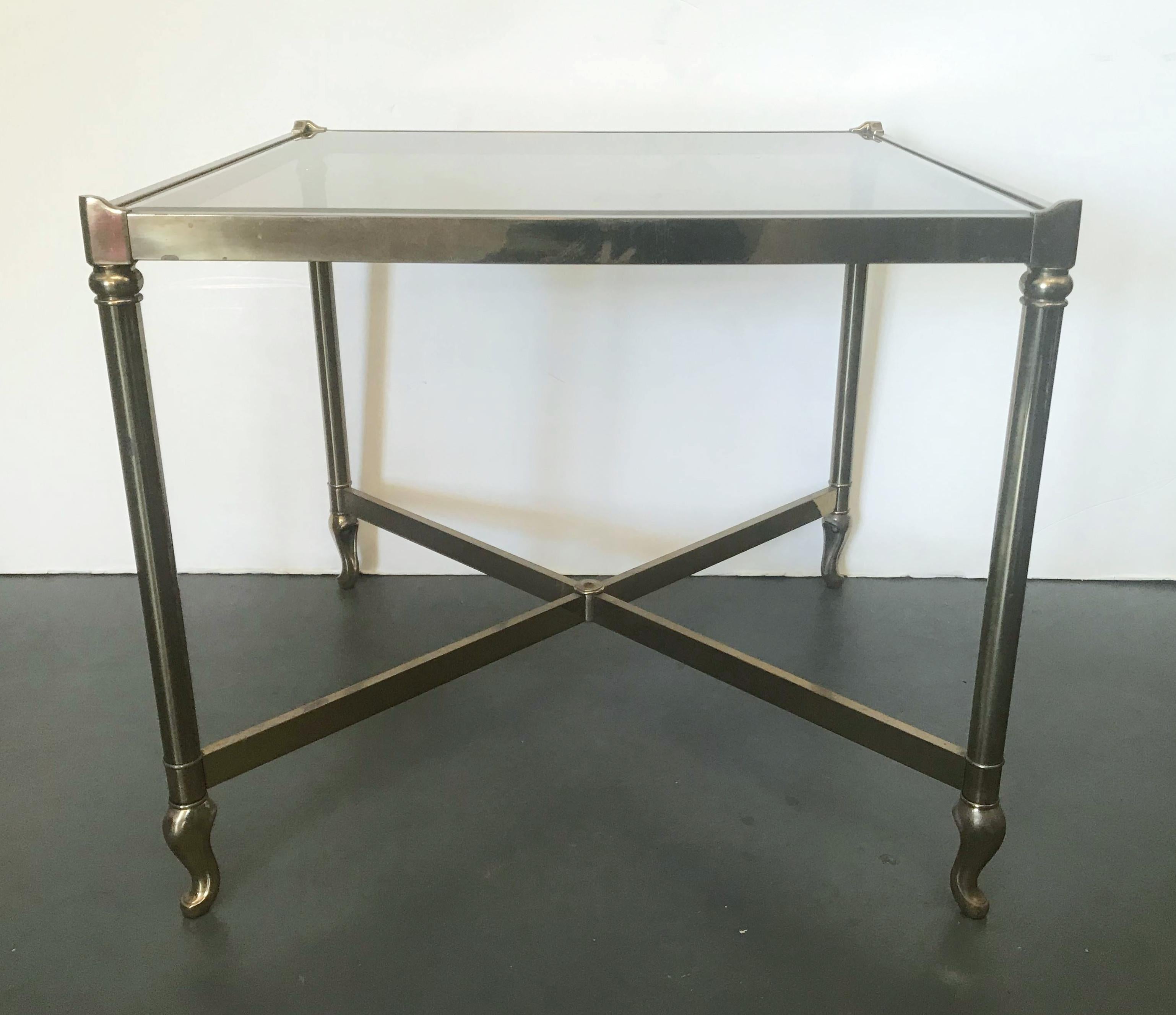 Vintage square side table made of solid brass frame with smoky beveled glass top, made in the USA, circa 1970s
Measures: Length 27 inches, width 27 inches, height 23.5 inches
1 available in stock in Palm Springs ON FINAL CLEARANCE SALE for $1,199