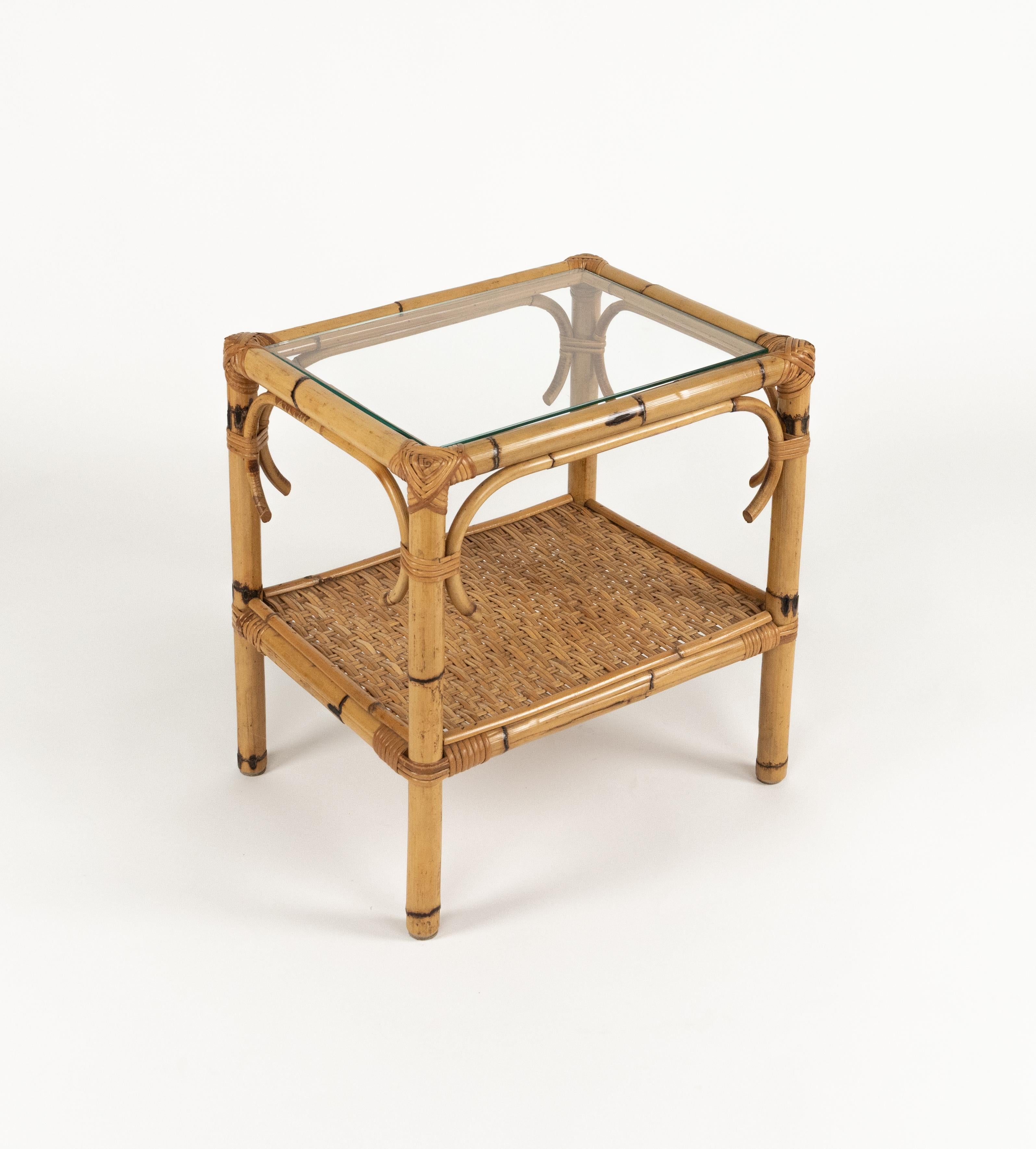 Midcentury beautiful side table or nightstand in bamboo and rattan with glass top.

Made in Italy in the 1970s.