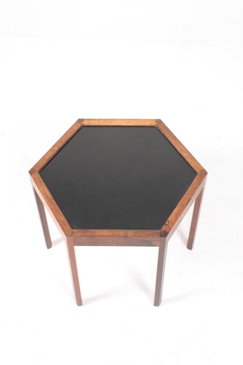 Elegant side table in rosewood and formica designed and made Hans C. Andersen. Great original condition.