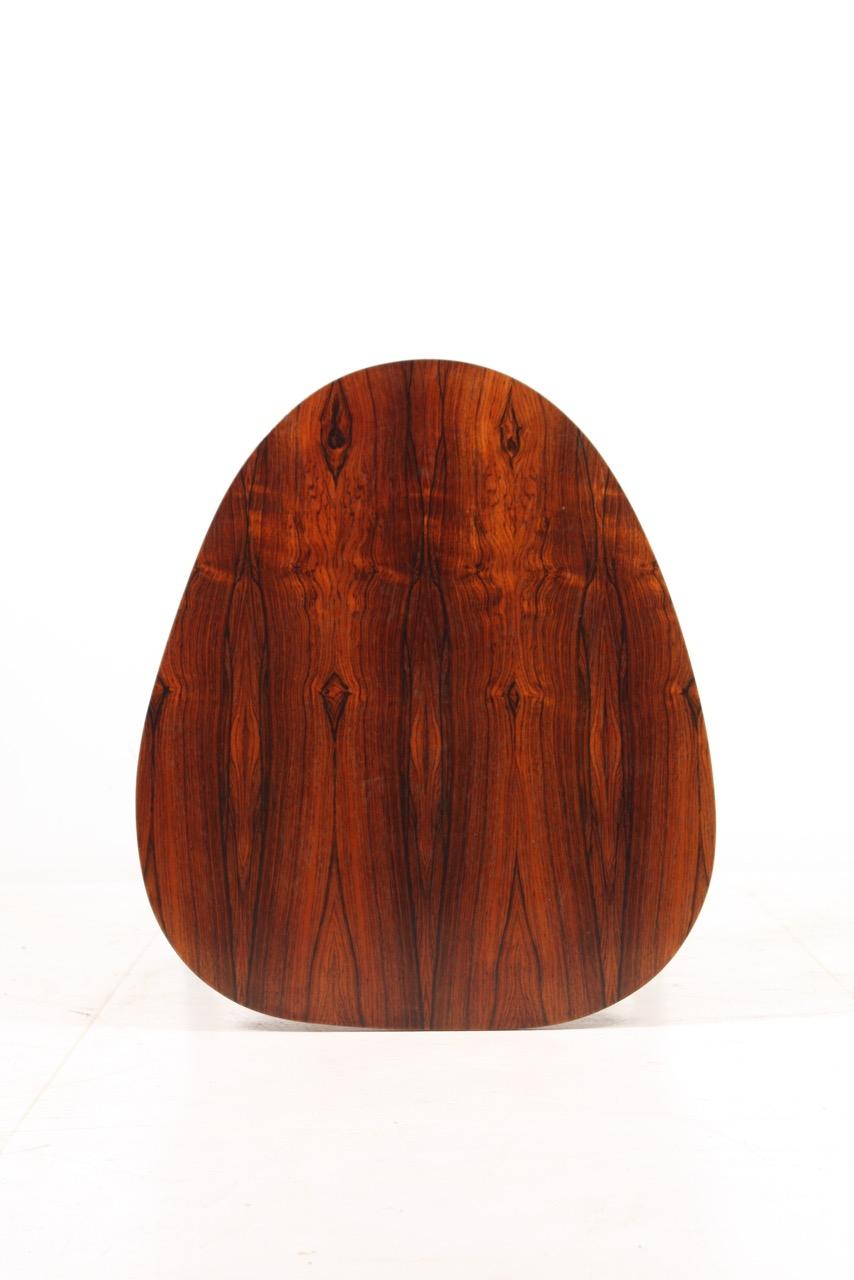Elegant side table in rosewood. Designed and made in Denmark 1960s. Great original condition.